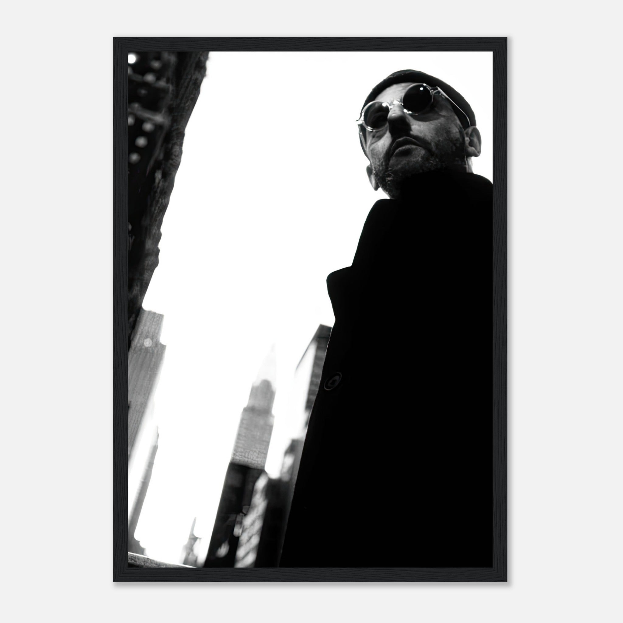 Black-and-white framed print of a man in sunglasses against an iconic urban backdrop, showcasing cinematic style.