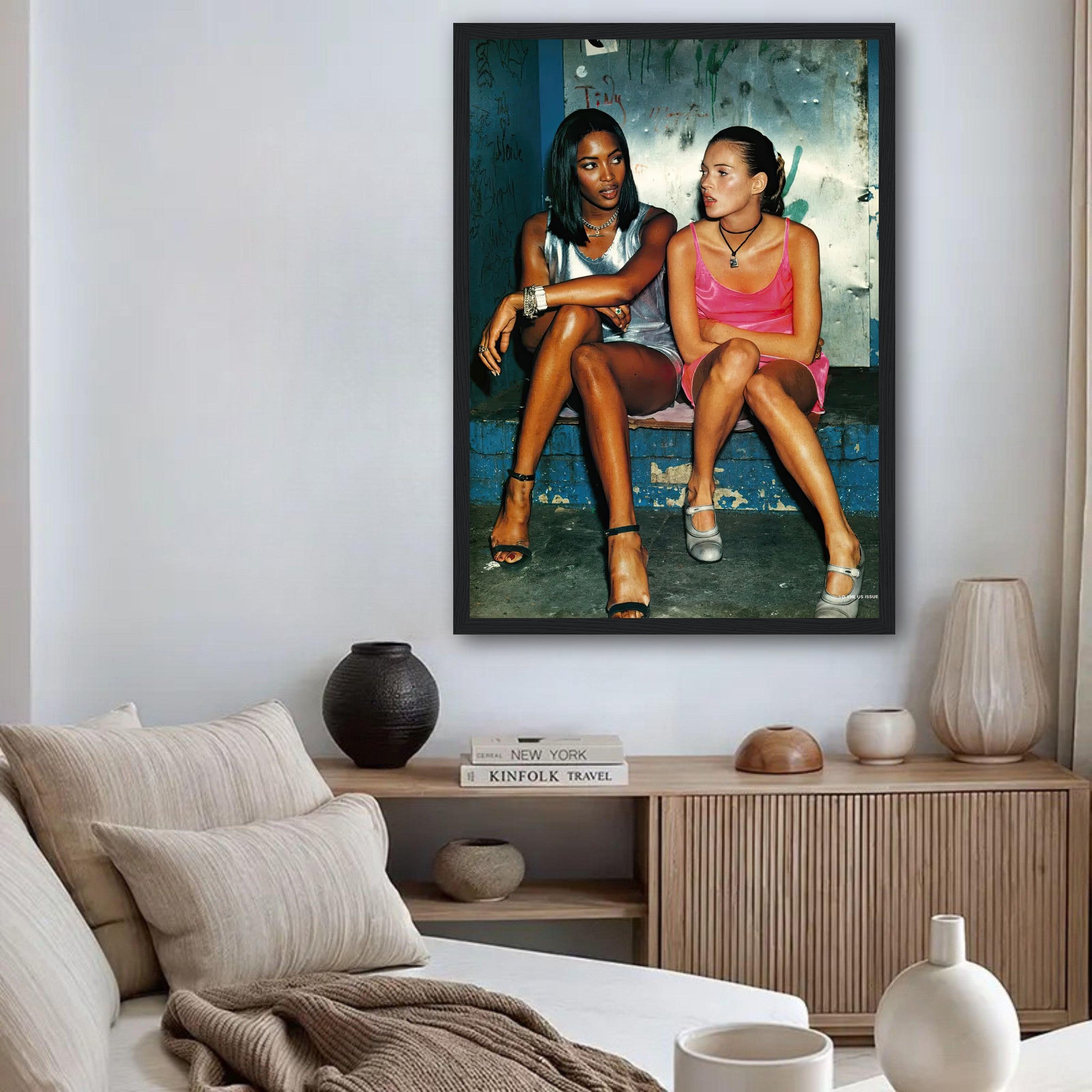 Framed print of Naomi Campbell and Kate Moss, showcasing 90s fashion and style in a modern living room setting.