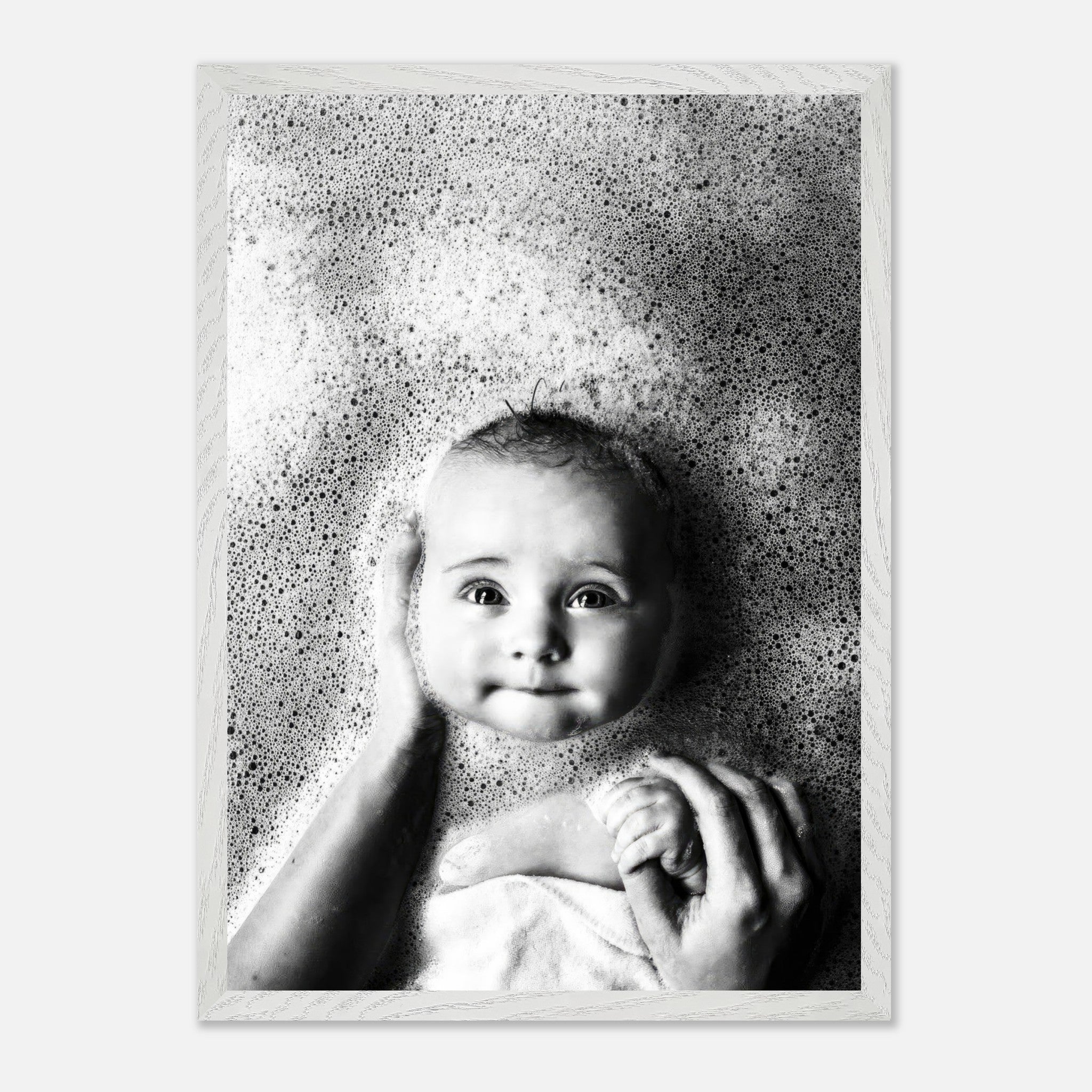 Vintage black and white baby bath photography with bubbles, showcasing a smiling infant in serene ambiance.