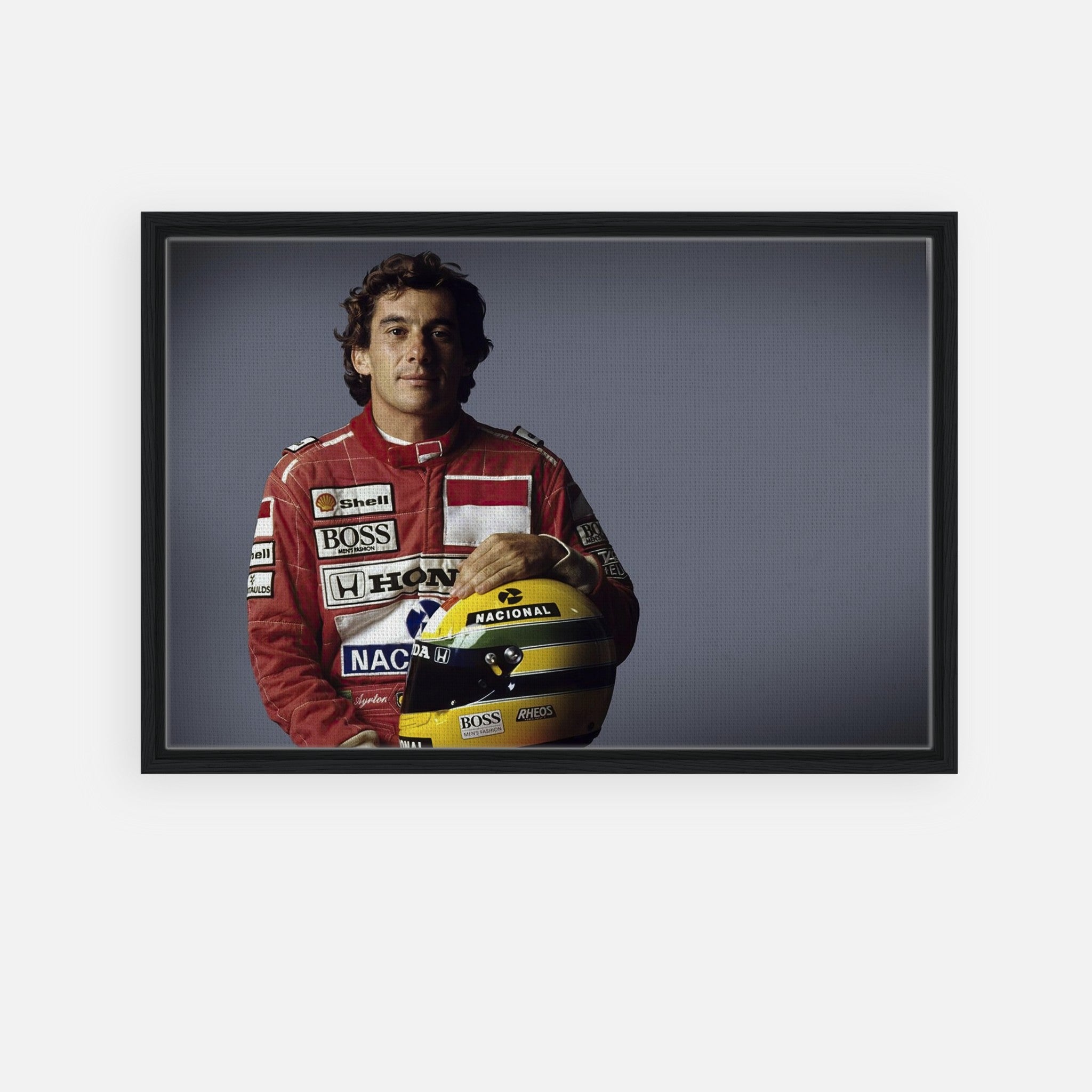 Ayrton Senna framed canvas print, showcasing the legendary Formula 1 driver in his iconic racing suit.
