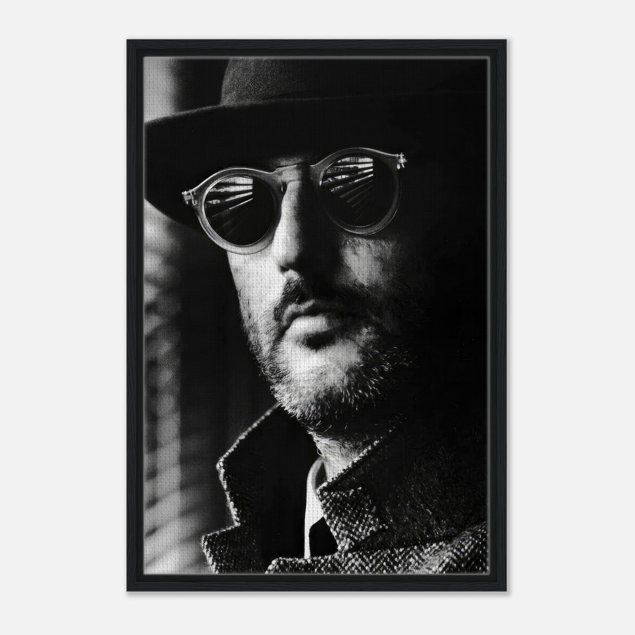 Black-and-white canvas print of Jean Reno, framed in black, showcasing cinematic artistry and sophistication.