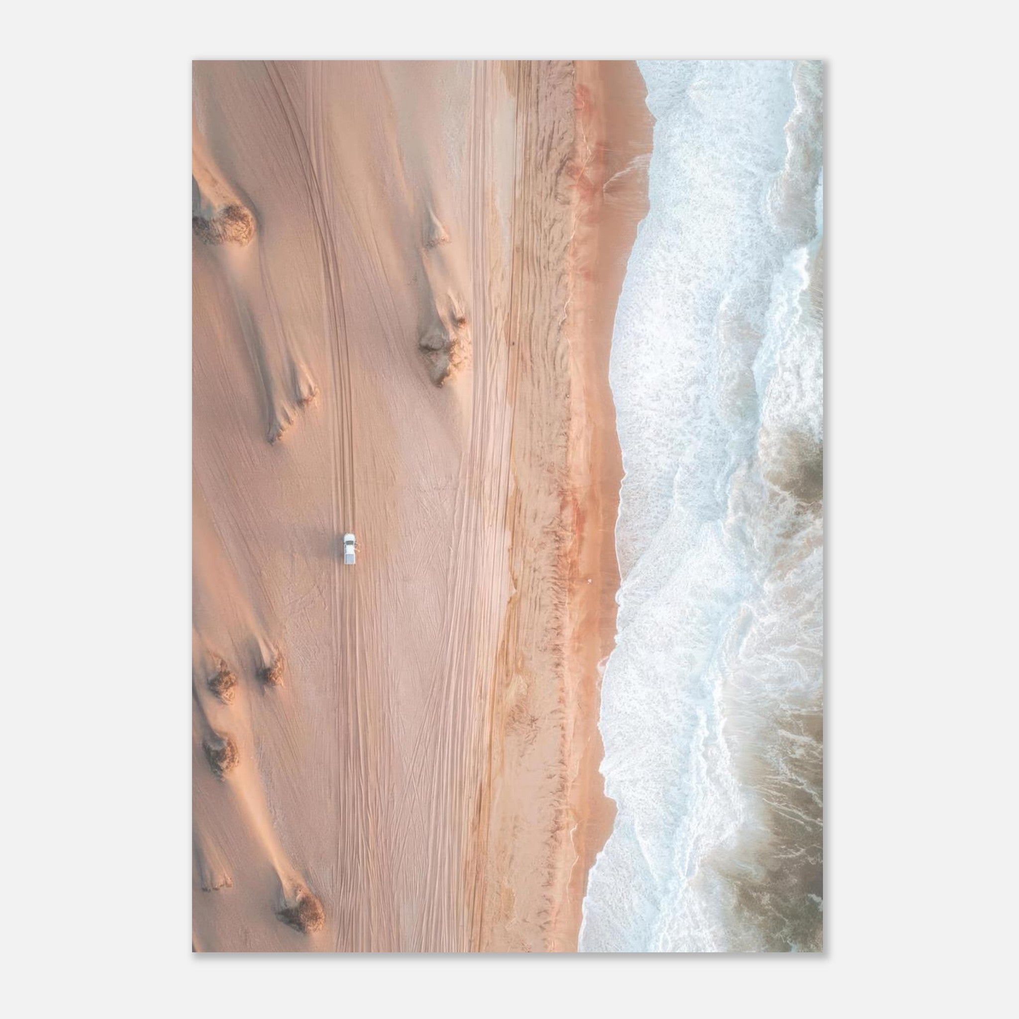 Aerial view of a sandy desert meeting ocean waves in a stunning drone photography poster.