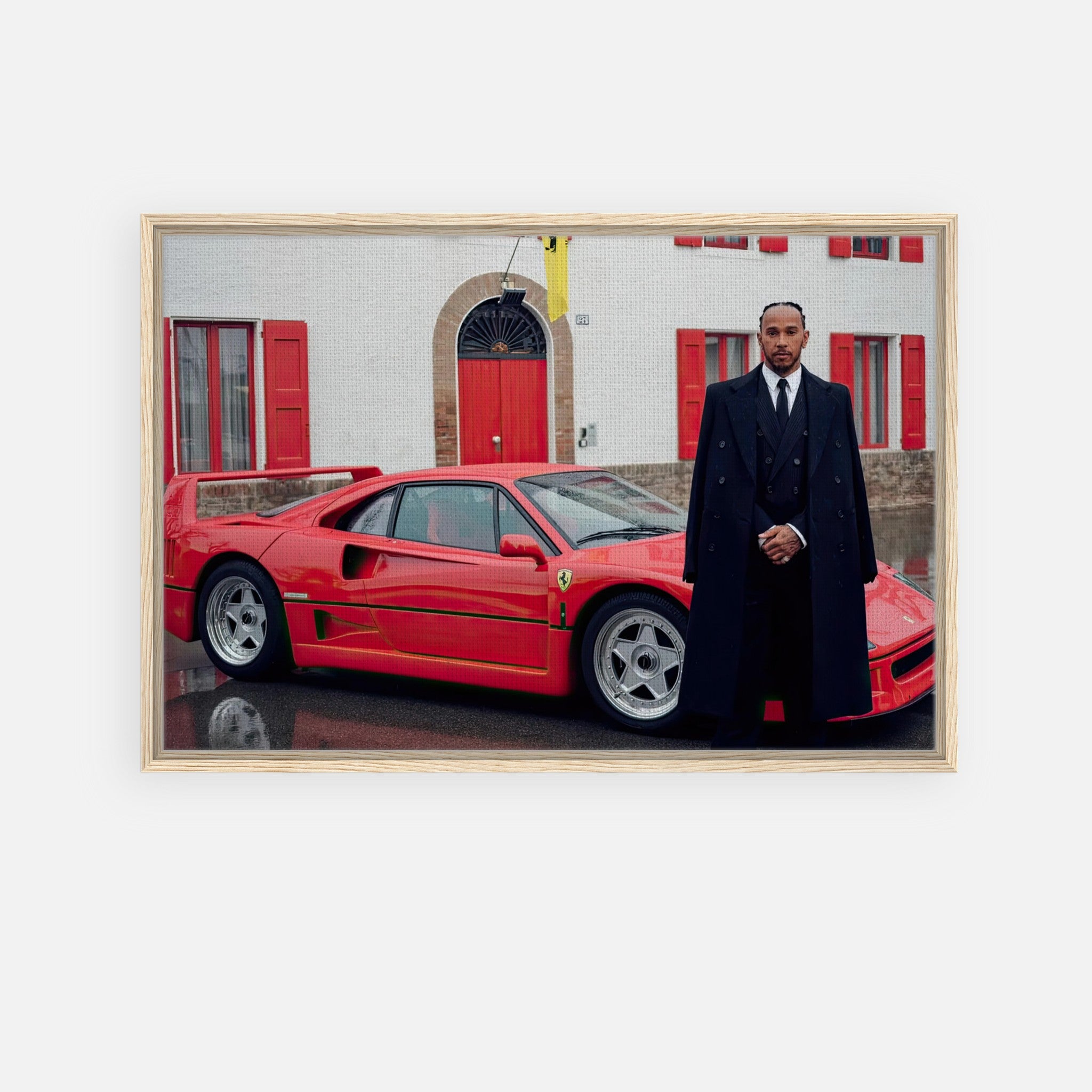 Lewis Hamilton standing by a red Ferrari F40, framed canvas print celebrating his racing debut.