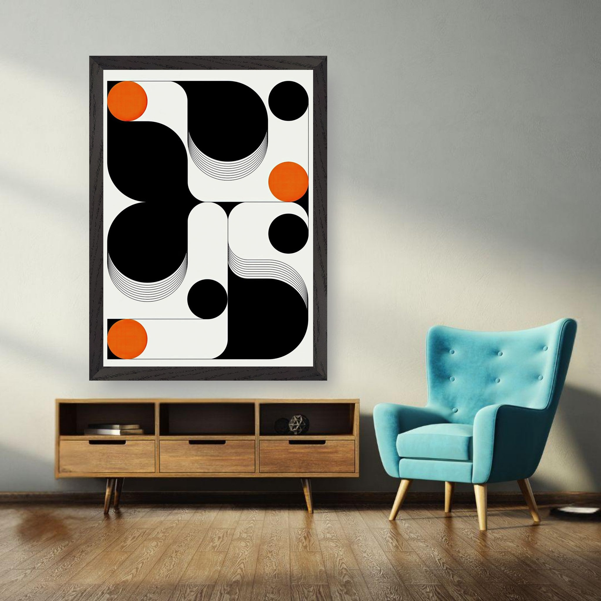 Modern geometric abstract art print framed in black, showcasing bold shapes and vibrant orange accents in a chic interior setting.