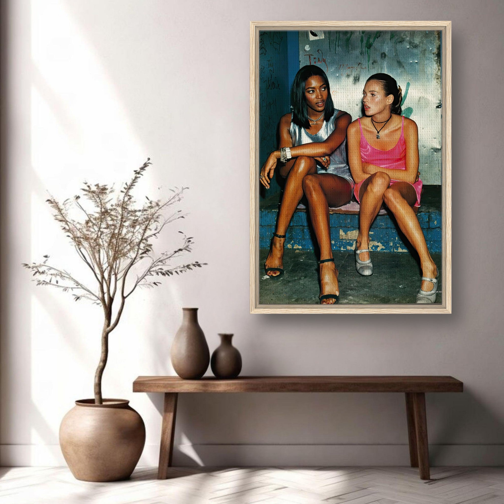 Framed canvas print of supermodels Naomi Campbell and Kate Moss showcasing 90s fashion glamour.