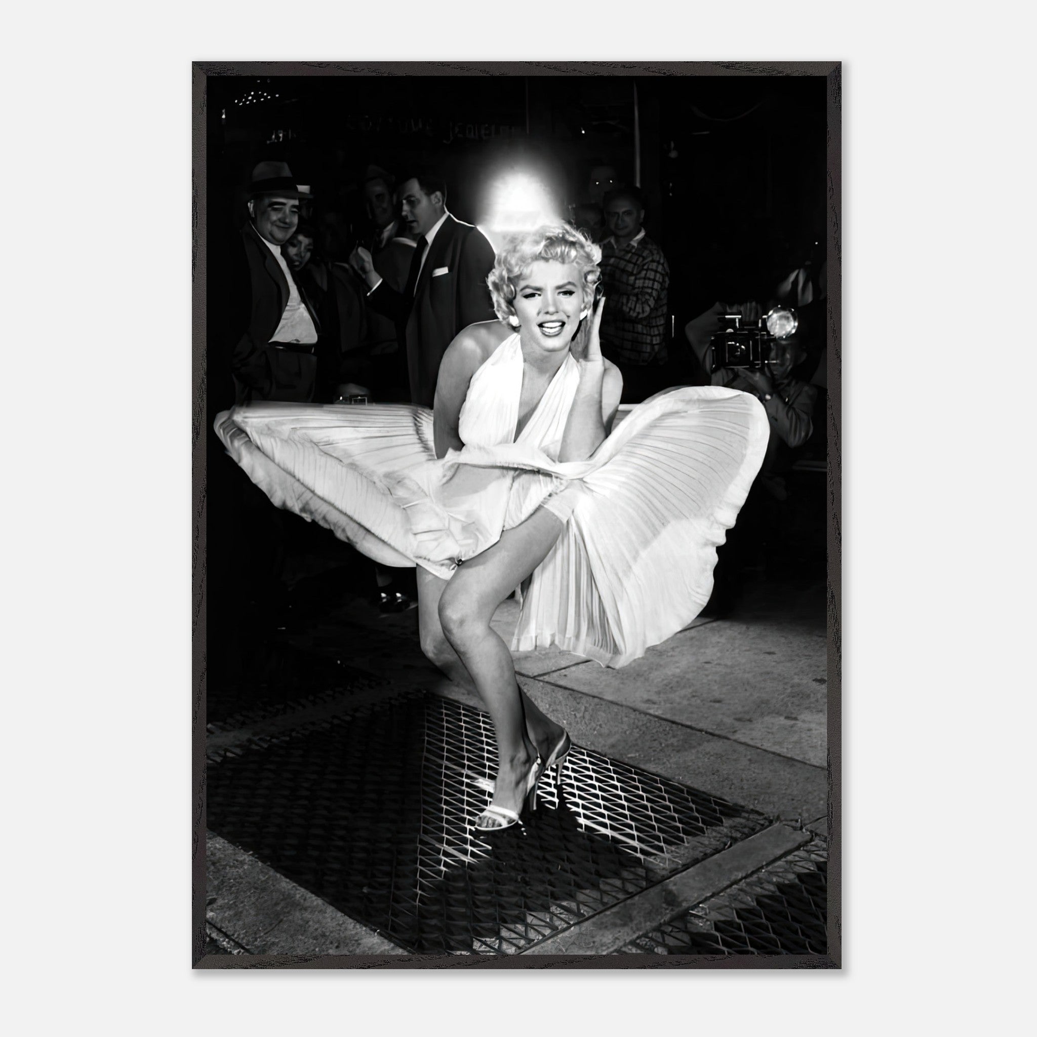 Marilyn Monroe in iconic white dress, playfully lifted by the wind, capturing timeless Hollywood glamour.