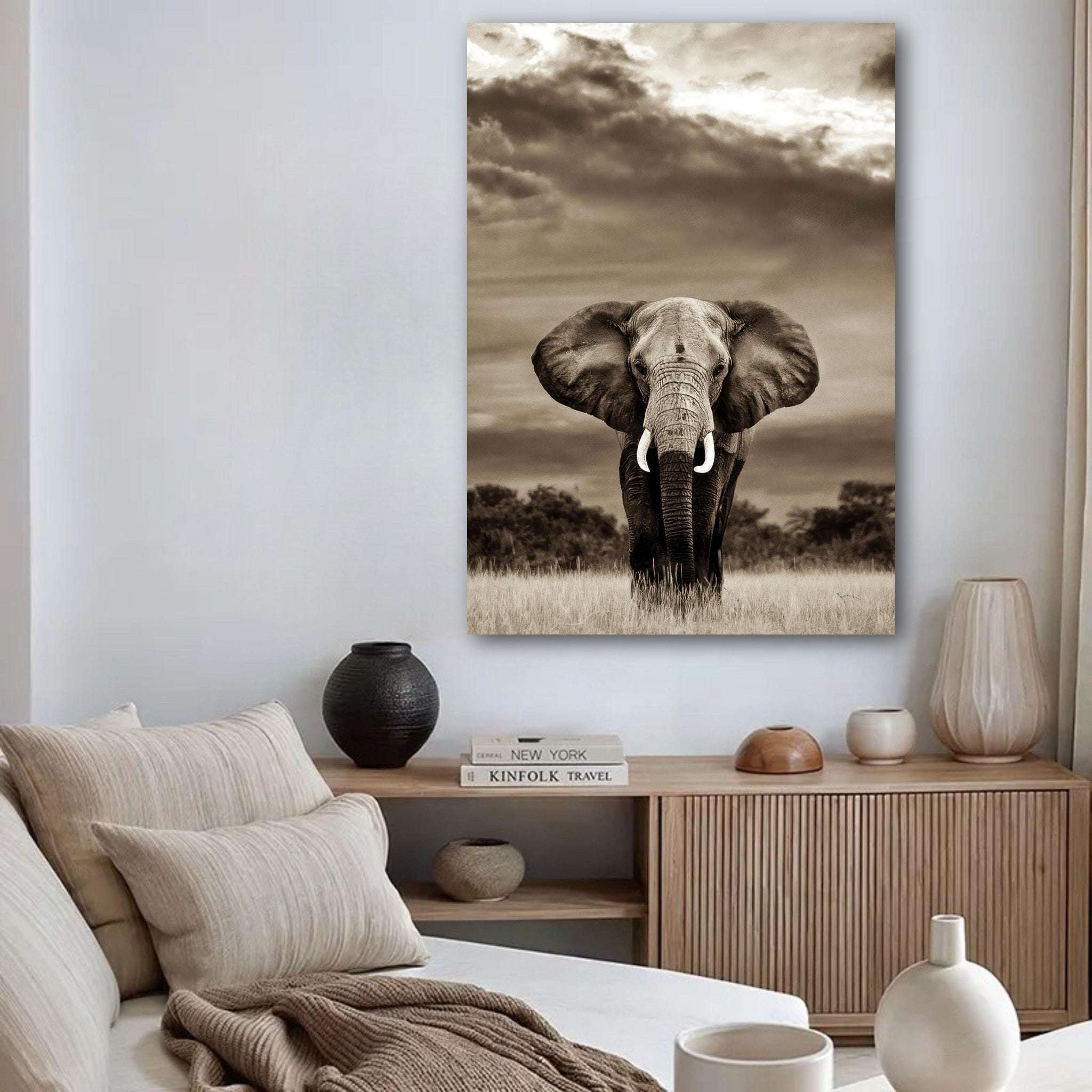 Monochrome elephant portrait photography poster displayed in a modern living room setting.
