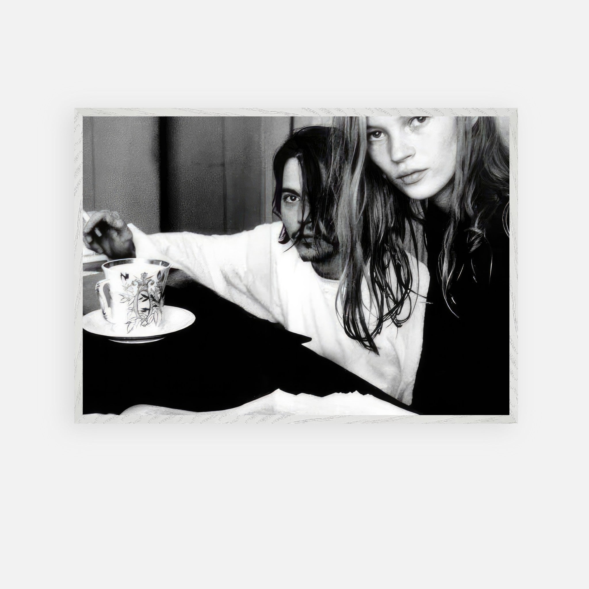 Vintage framed art print of Johnny Depp and Kate Moss capturing 90s rebellion and romance in black and white.