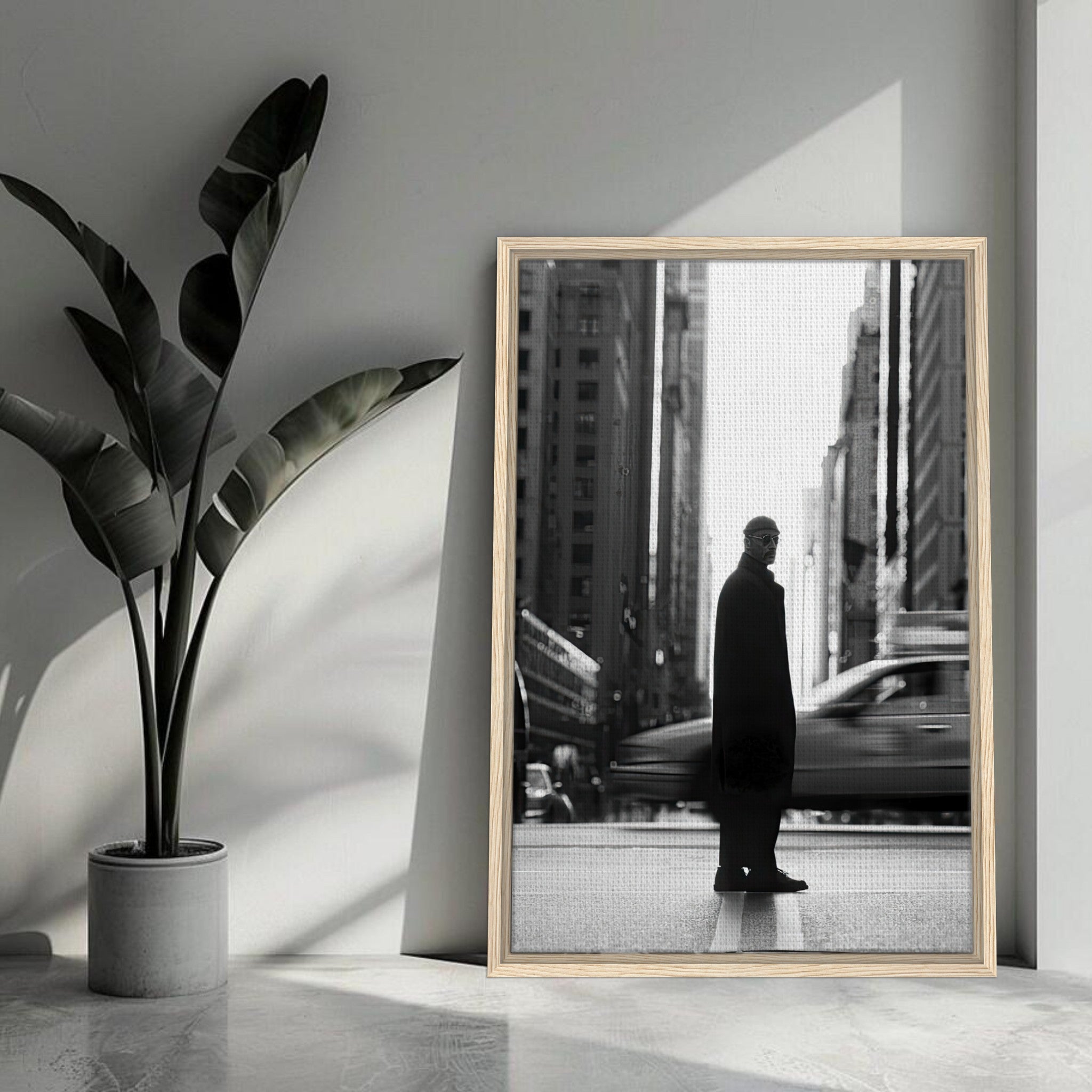 Framed canvas artwork of Jean Reno as Leon in black and white, set against a busy New York City street.