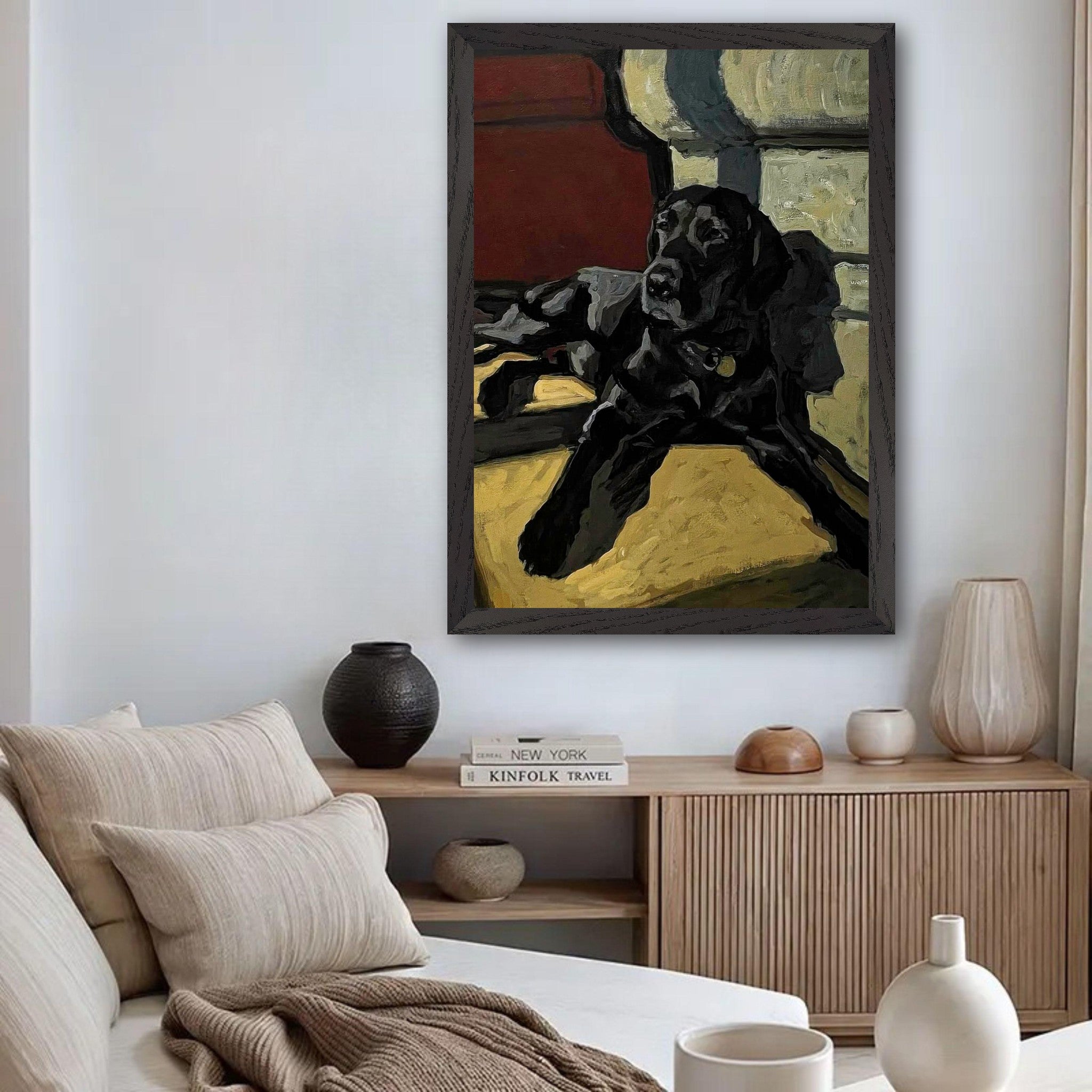 Black Labrador dog painting in vintage frame on wall, featuring expressive brushstrokes and warm light ambiance.