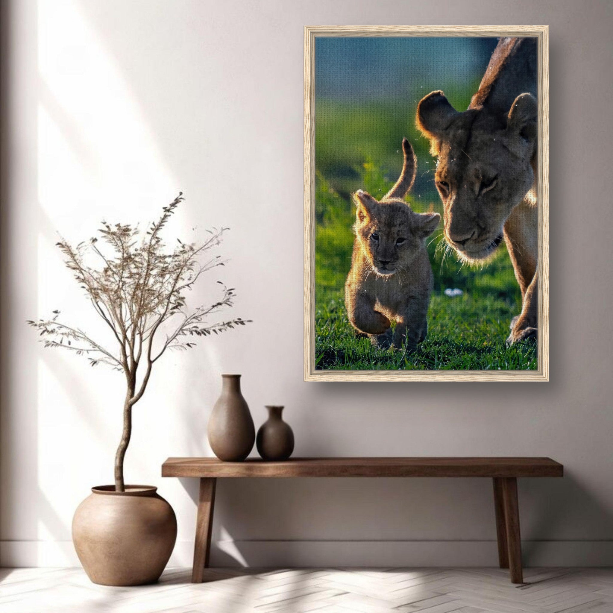Framed canvas print of a lioness and her cub in a sunlit savanna, depicting the bond of motherhood.