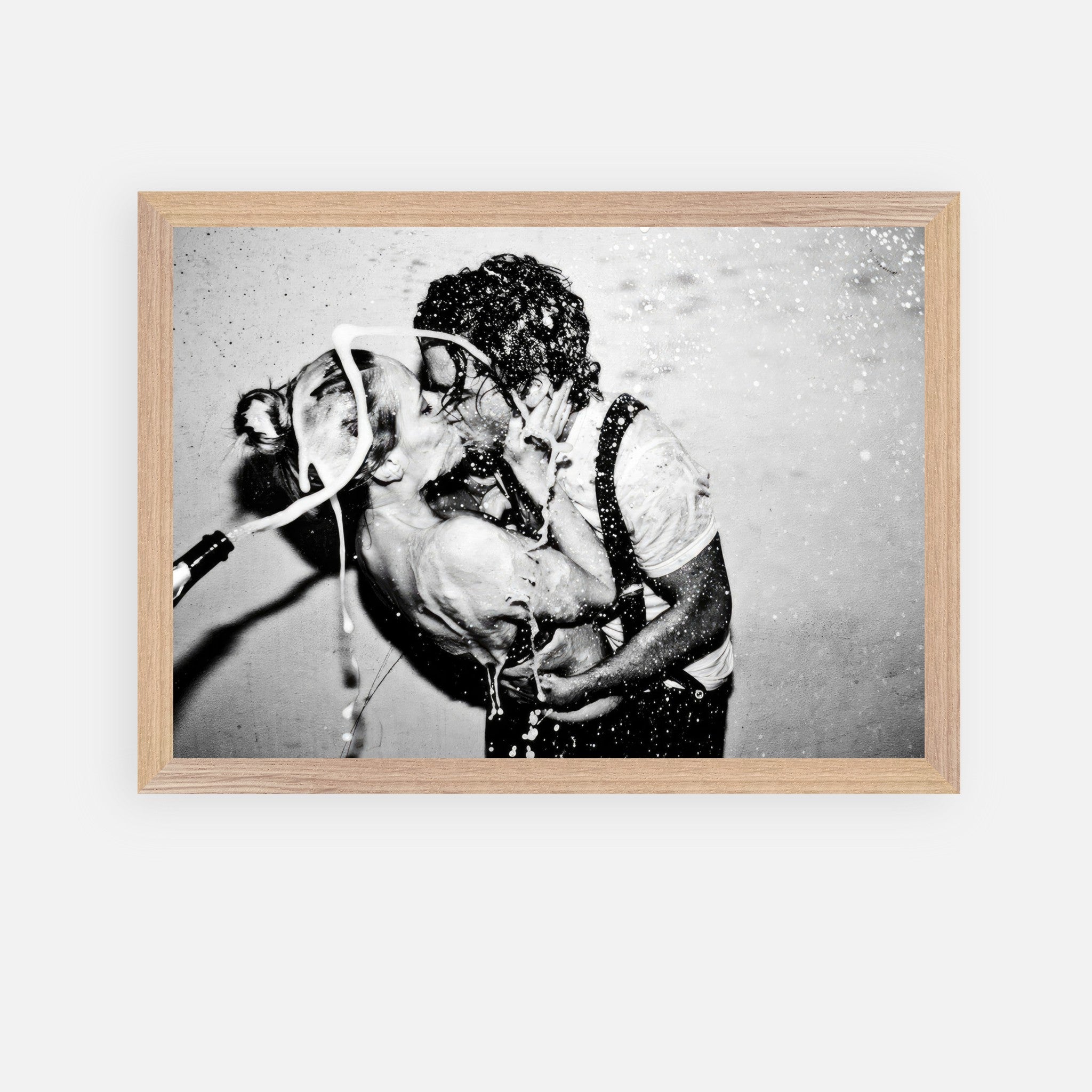 The Champagne Kiss vintage framed art featuring a passionate kiss and champagne celebration by Johnny Depp and Kate Moss.