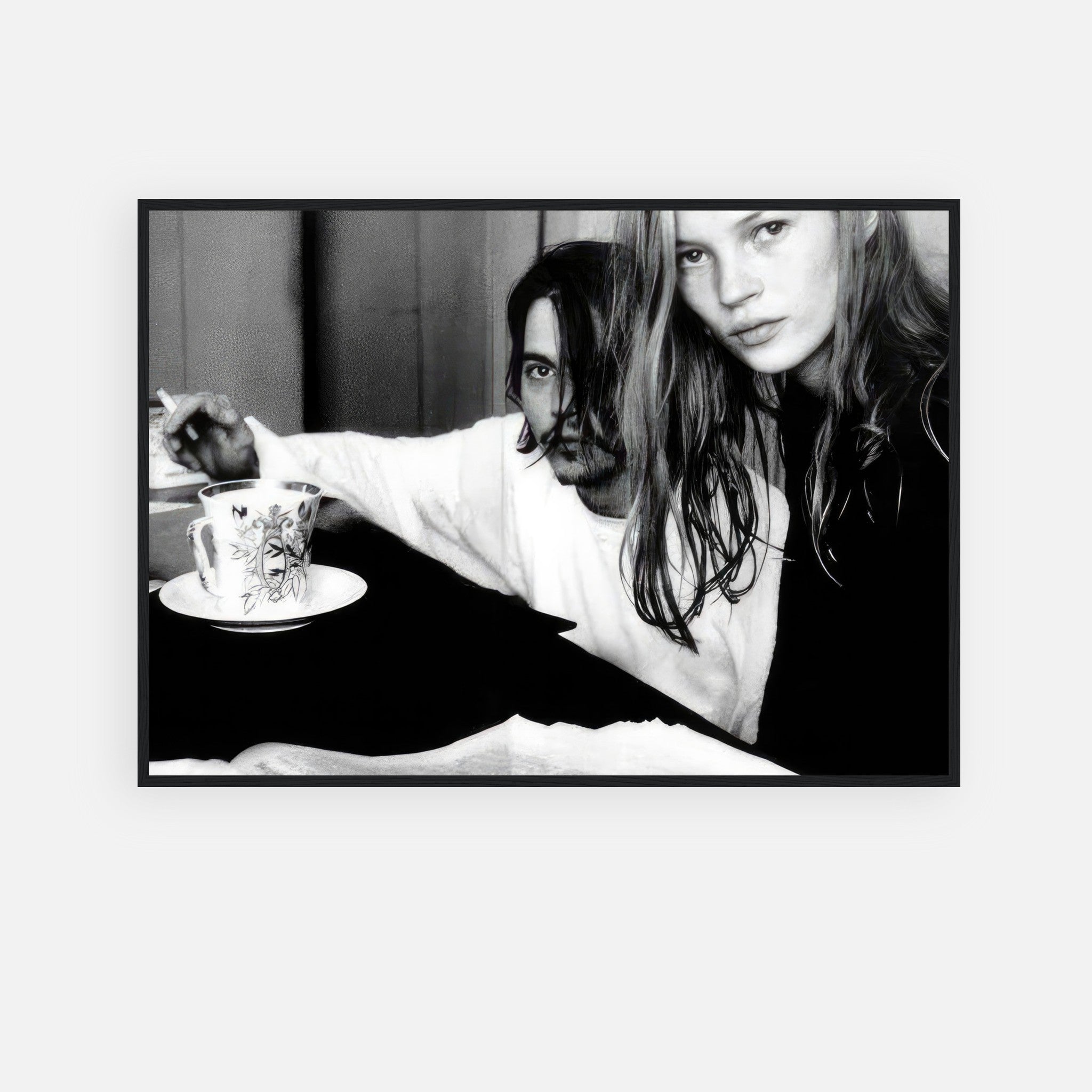 Framed print of Johnny Depp and Kate Moss in black-and-white, capturing 90s romance and intensity.