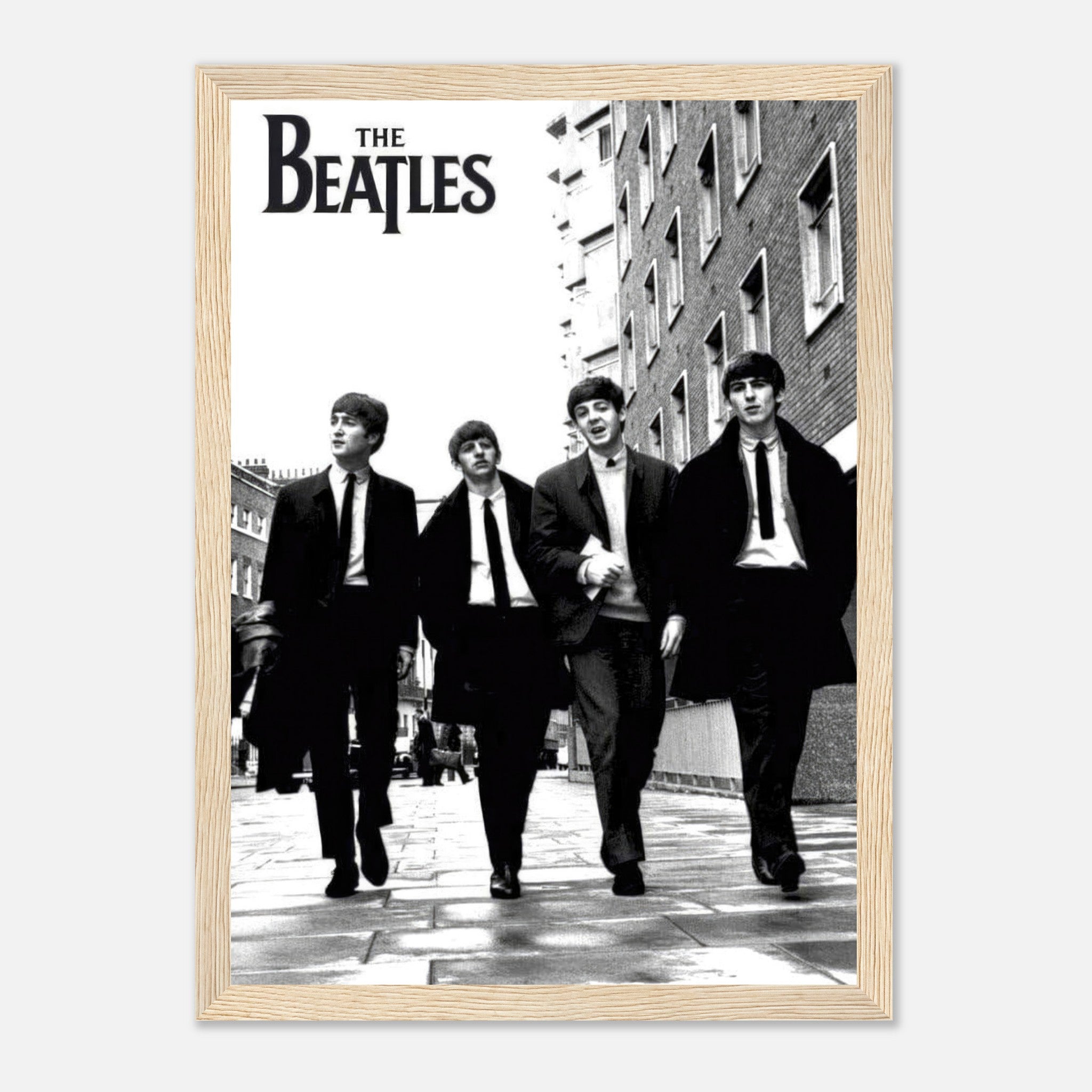The Beatles Cover framed print featuring iconic black and white image of the band walking together.