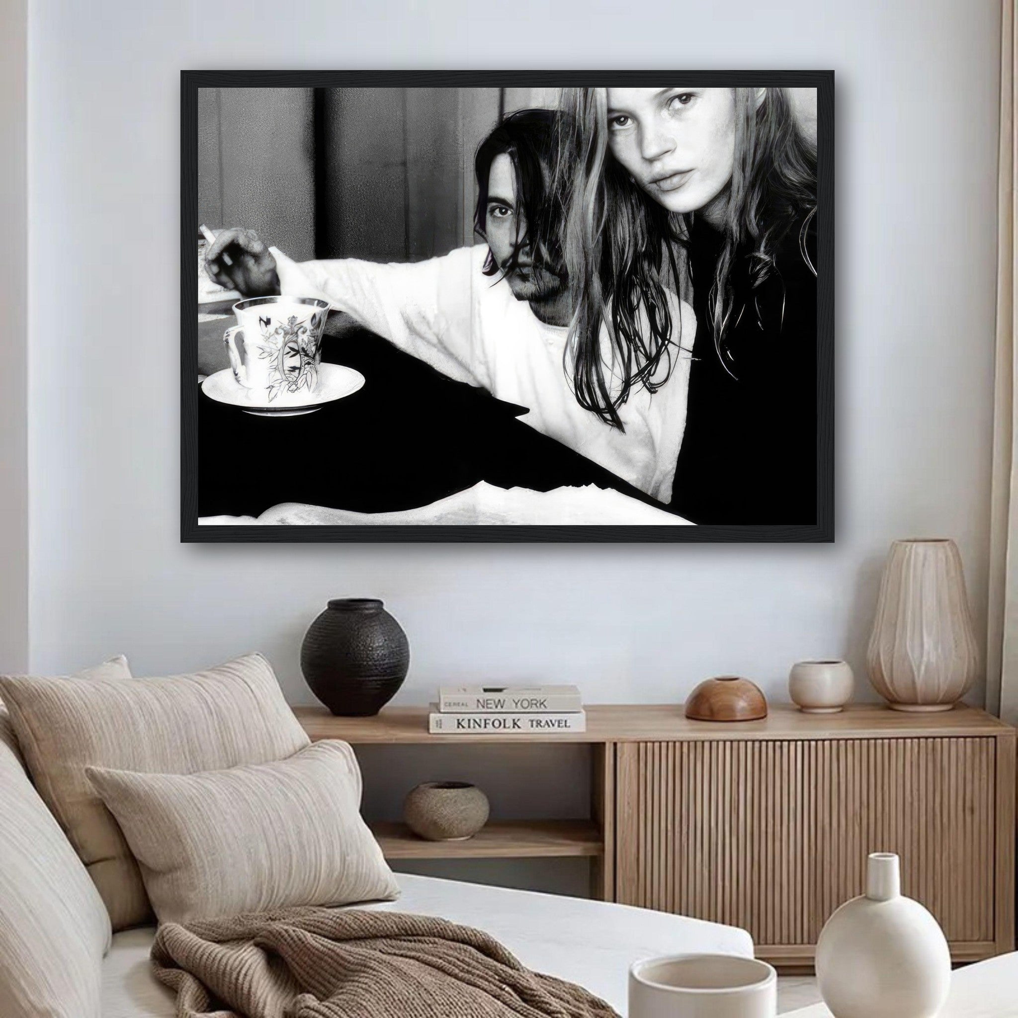Framed black-and-white print of Johnny Depp and Kate Moss, capturing 1990s romance and intensity.