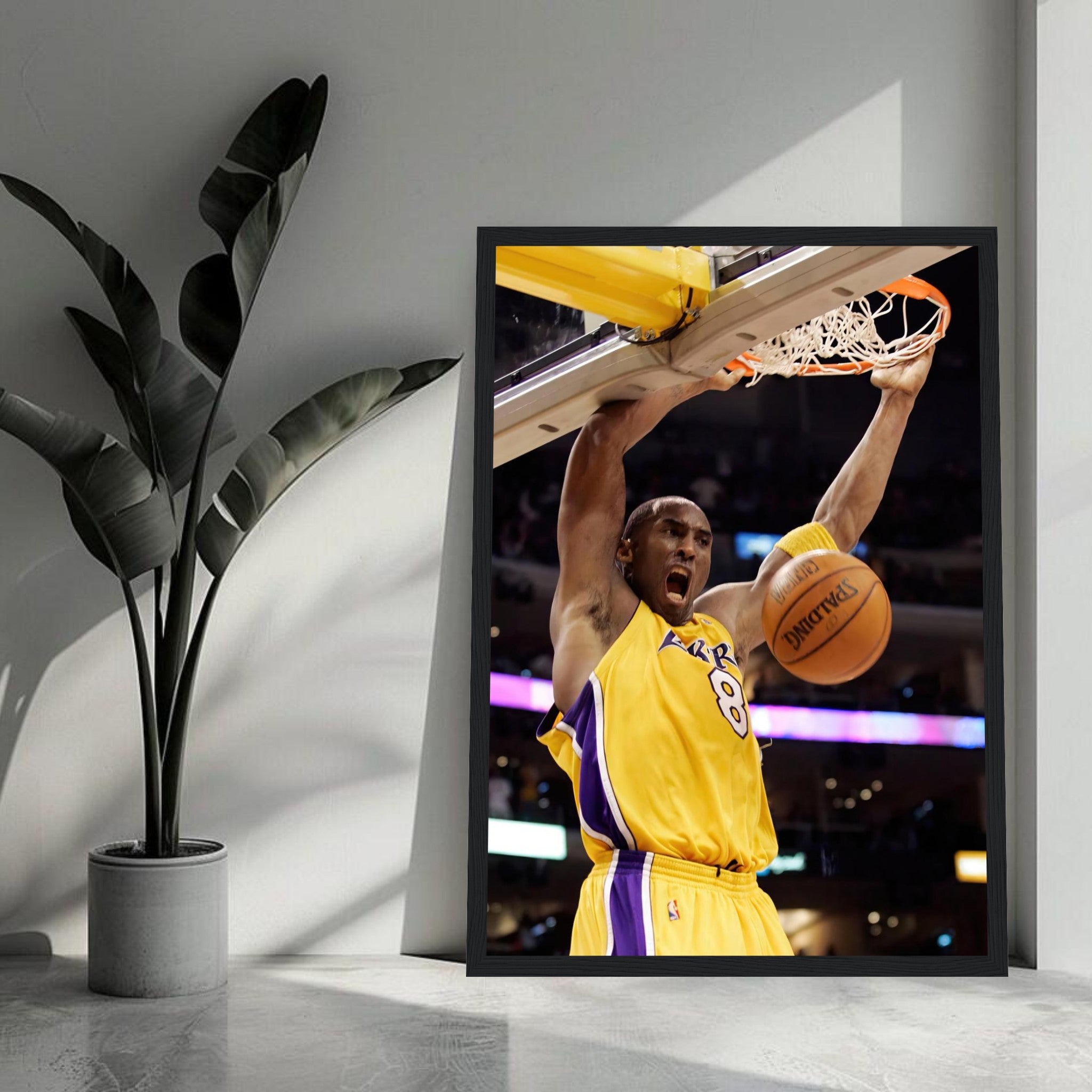 Kobe Bryant's iconic slam dunk framed print showcasing his determination in Lakers colors.