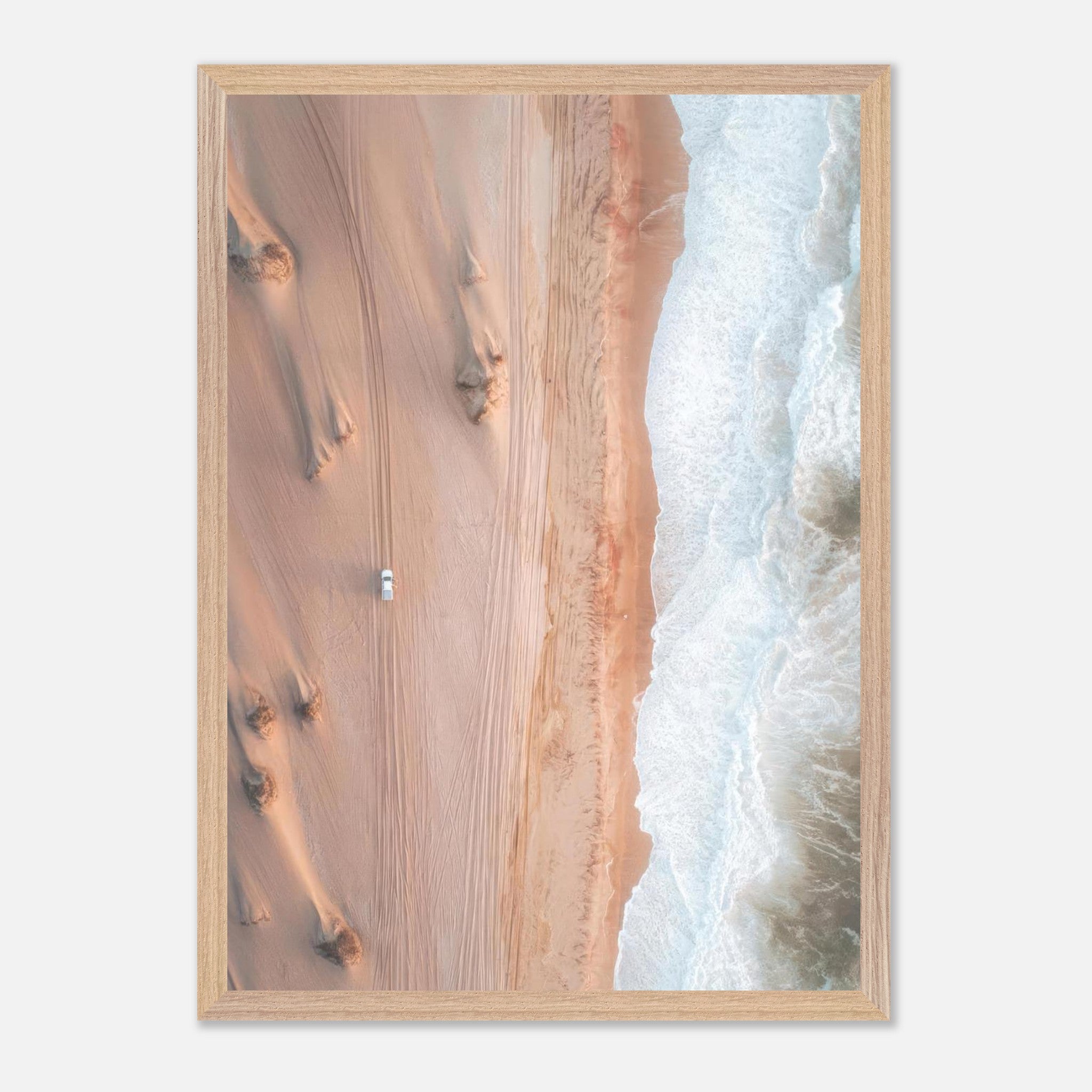 Drone photography of golden dunes meeting the ocean, showcasing the beauty of nature's landscapes.