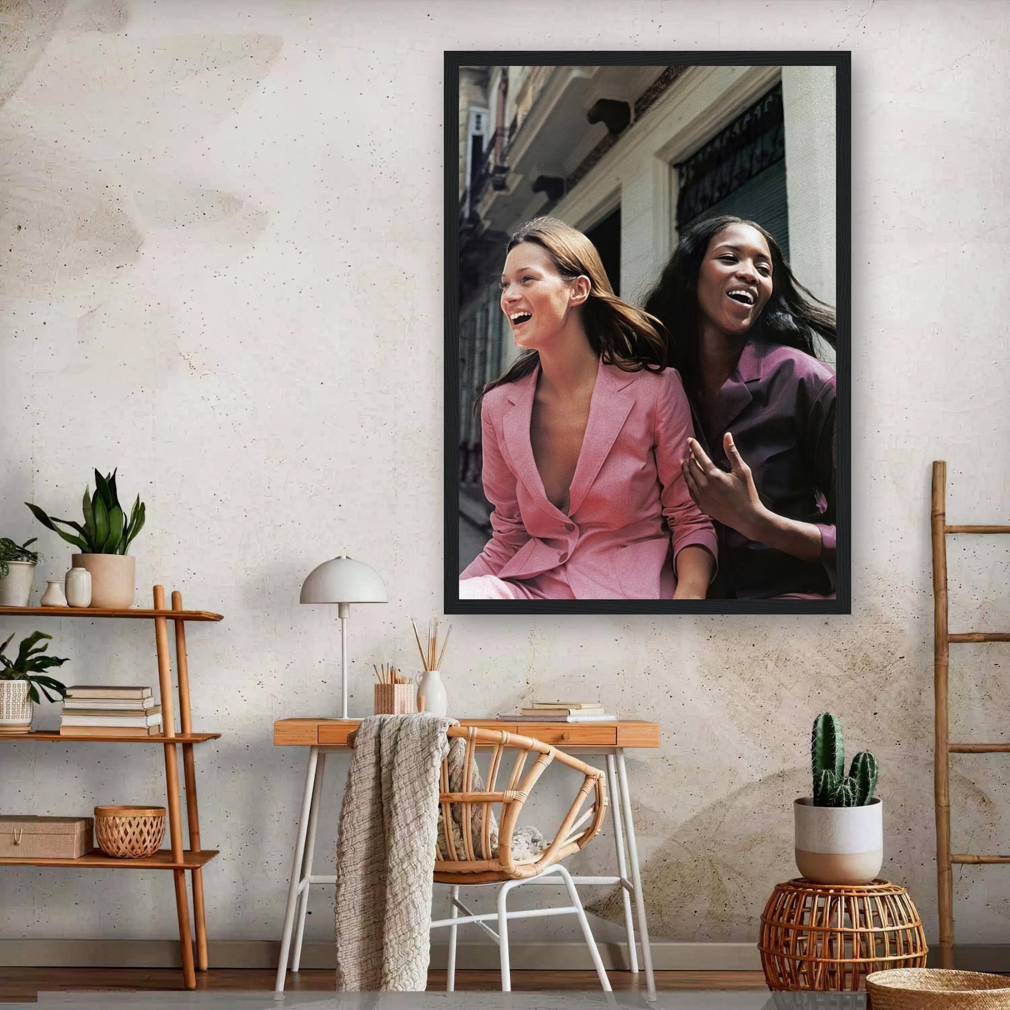 Framed print of Naomi Campbell and Kate Moss laughing, showcasing timeless fashion elegance and style.