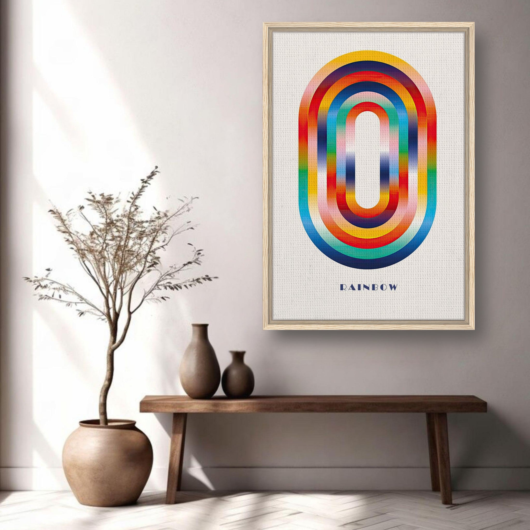 Framed abstract rainbow geometric art print displayed in modern interior with decorative vase and plant.