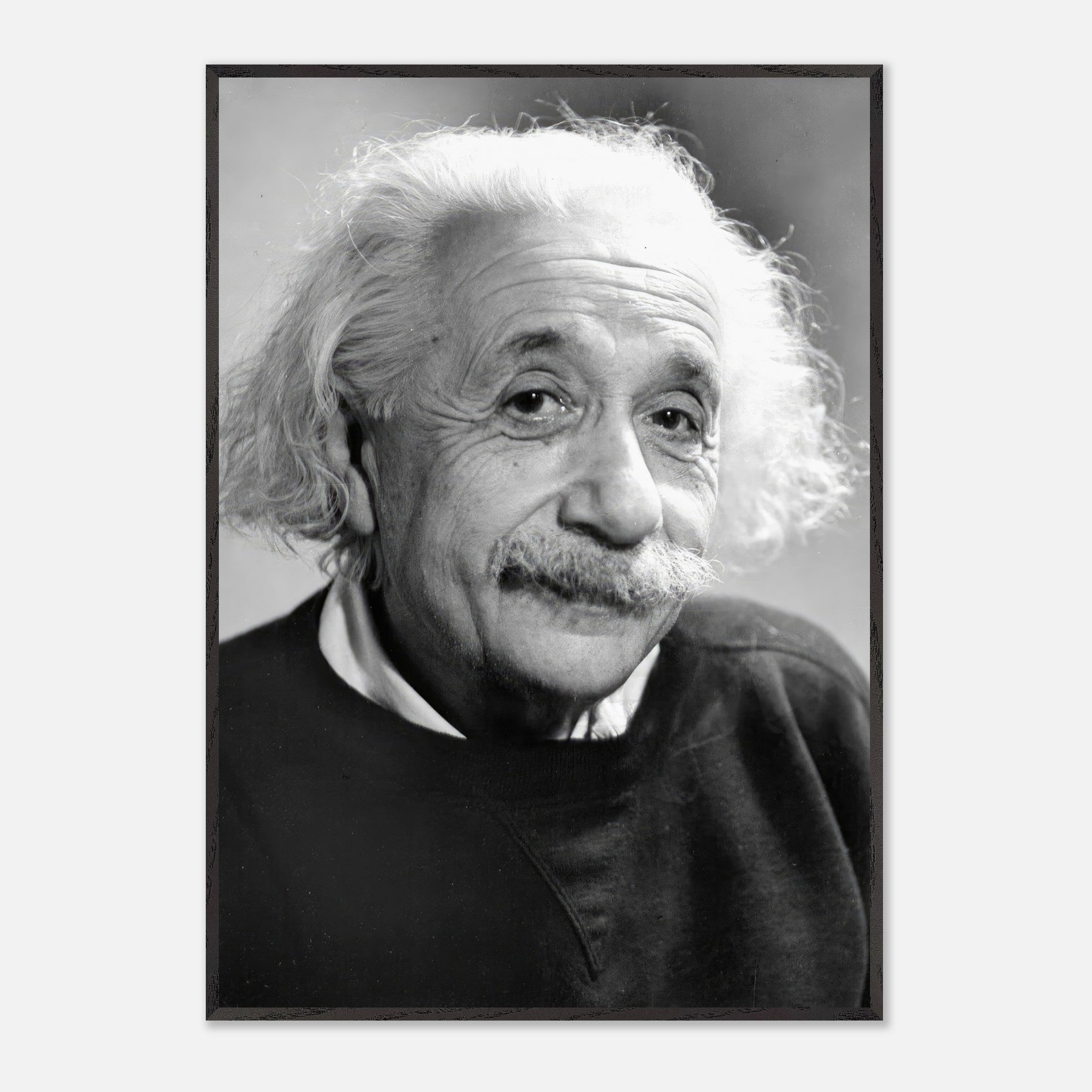 Black-and-white portrait of Albert Einstein, showcasing his expressive eyes and signature unruly hair from 1946.