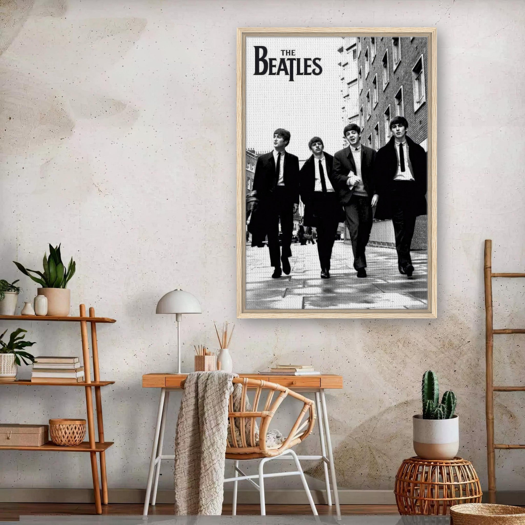 Framed canvas print of The Beatles walking in black and white, displayed in a modern home setting.