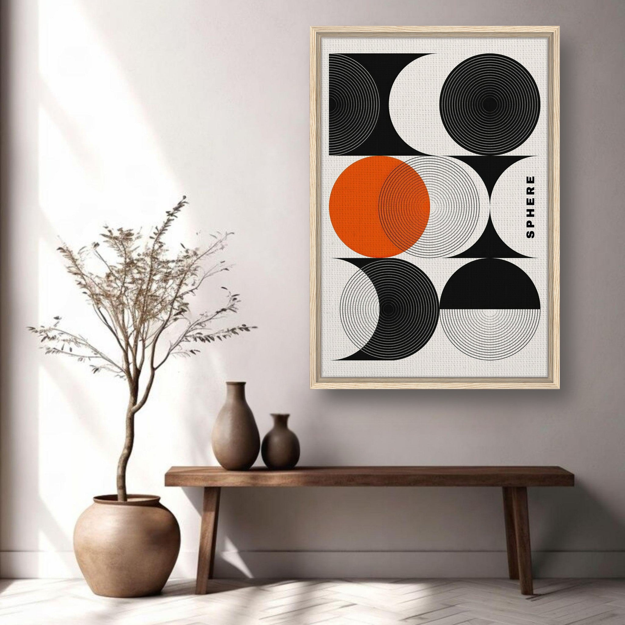 Abstract Geometric Sphere Art Framed Canvas Print with black, white, and orange circles in a modern living space.