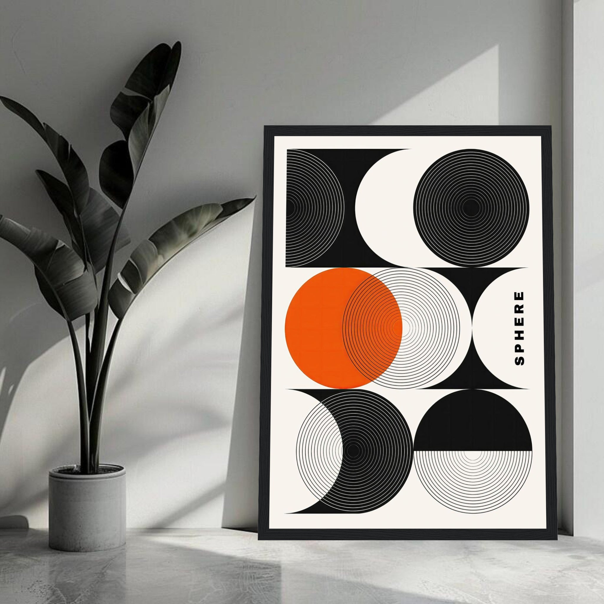 Abstract geometric sphere art framed print with black, white and orange circular patterns in modern decor.