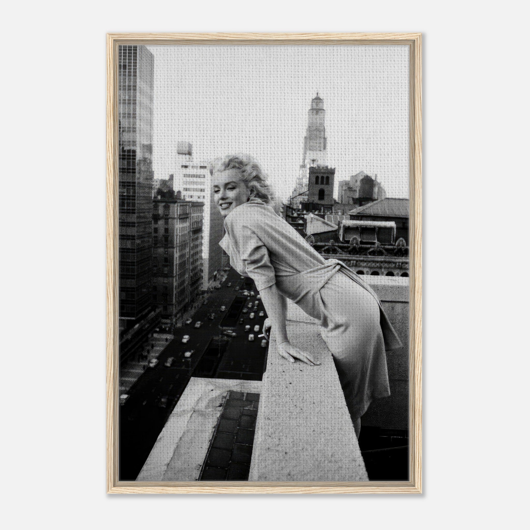 Marilyn Monroe on a rooftop in New York City, captured in a framed black-and-white canvas print.