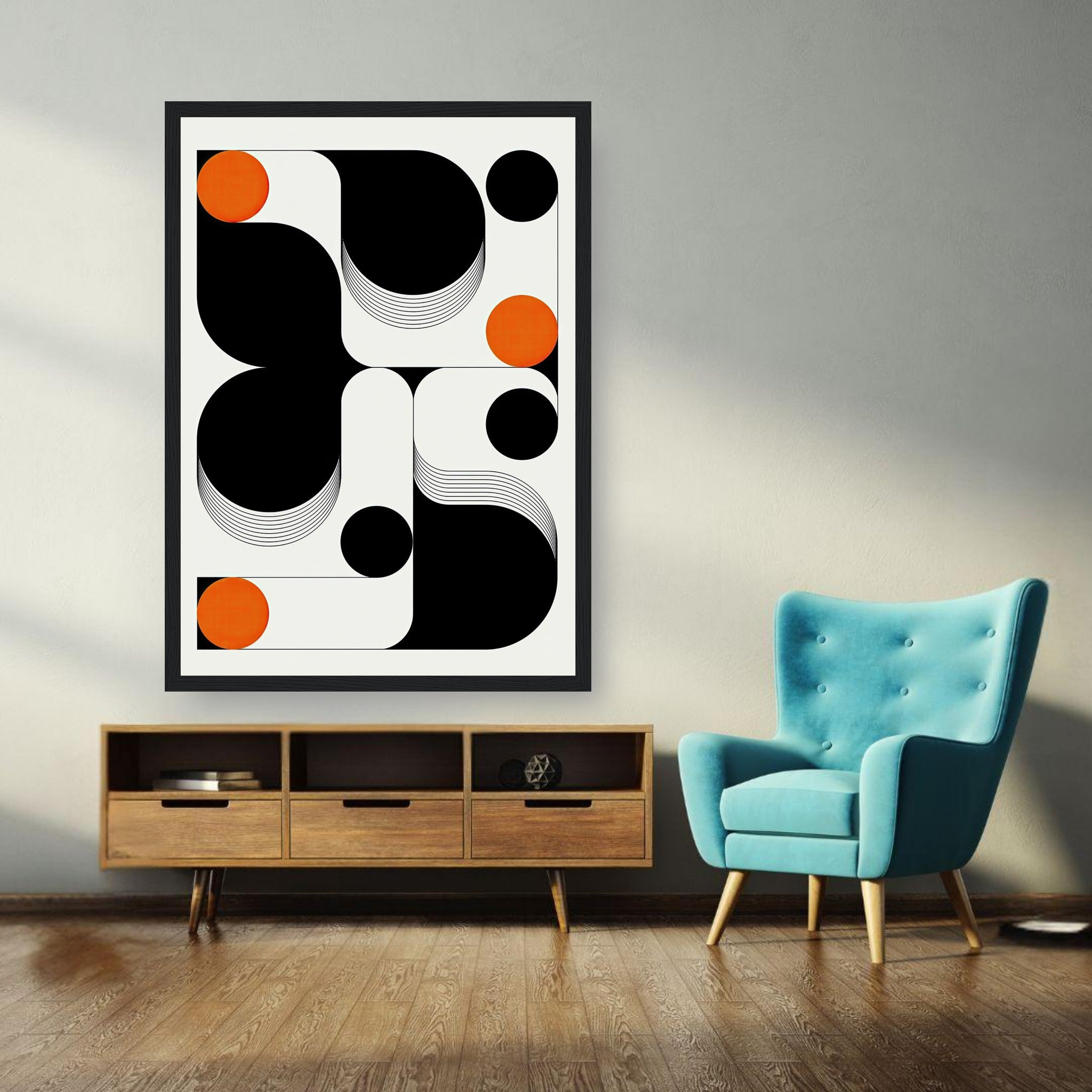 Modern geometric abstract art framed print featuring black, white, and orange shapes in a stylish living room setting.