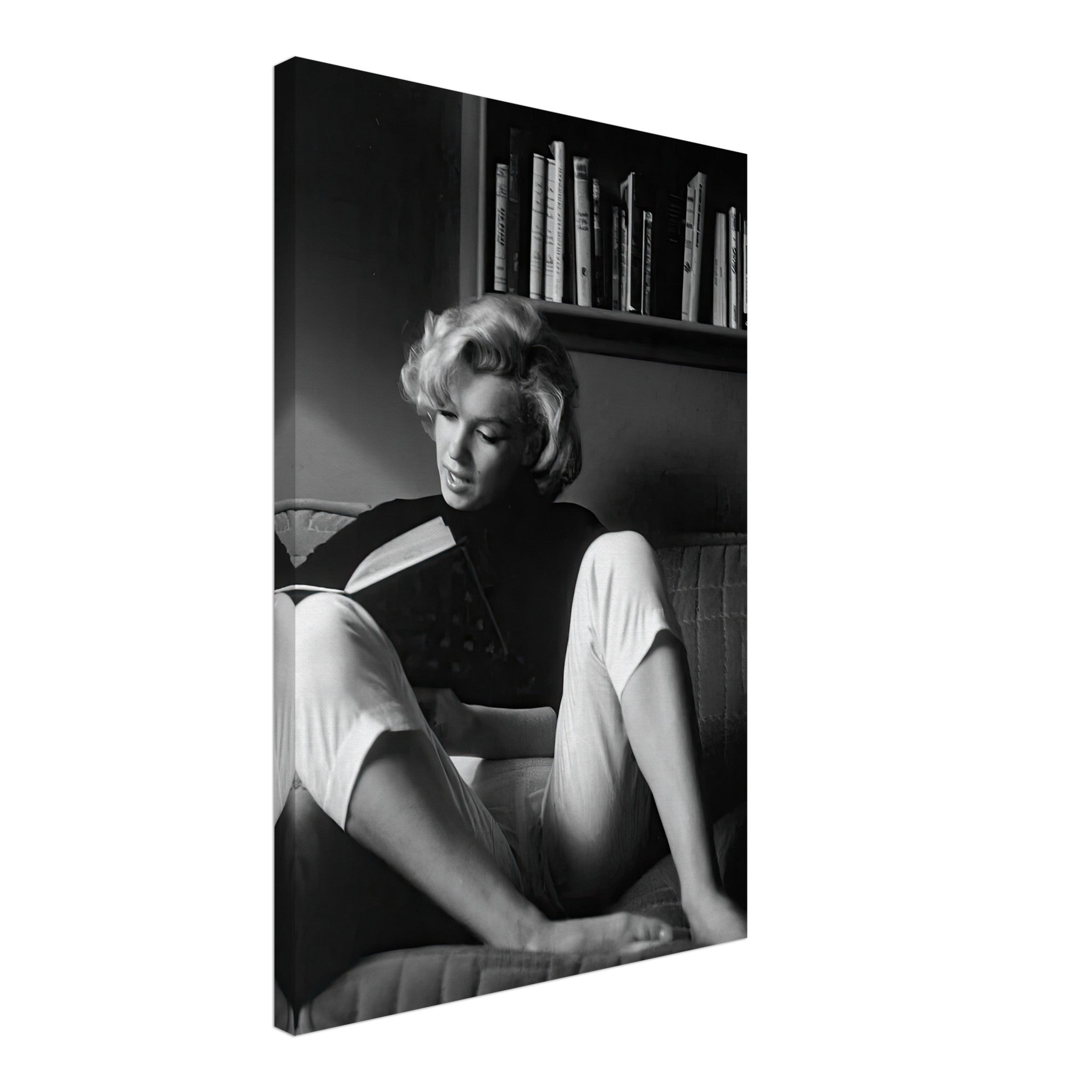 Marilyn Monroe reading at home, captured in a timeless black-and-white canvas art piece.