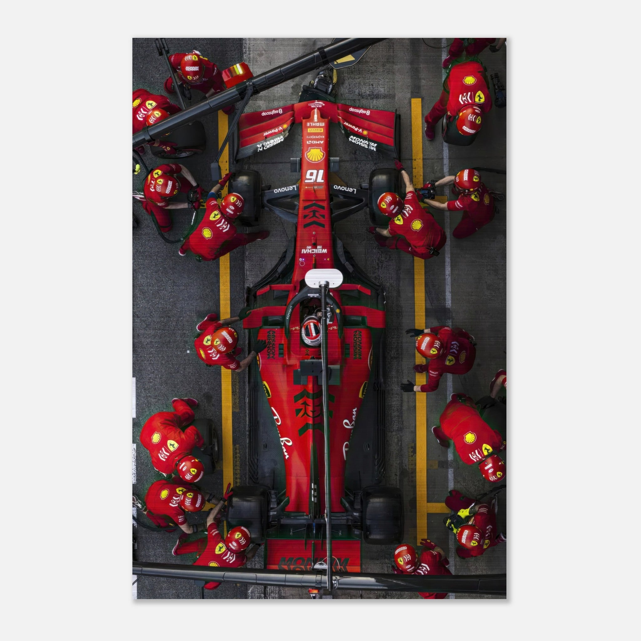 Brushed metal print of a Ferrari pitstop, showcasing dynamic Formula 1 racing with vibrant colors and intricate details.