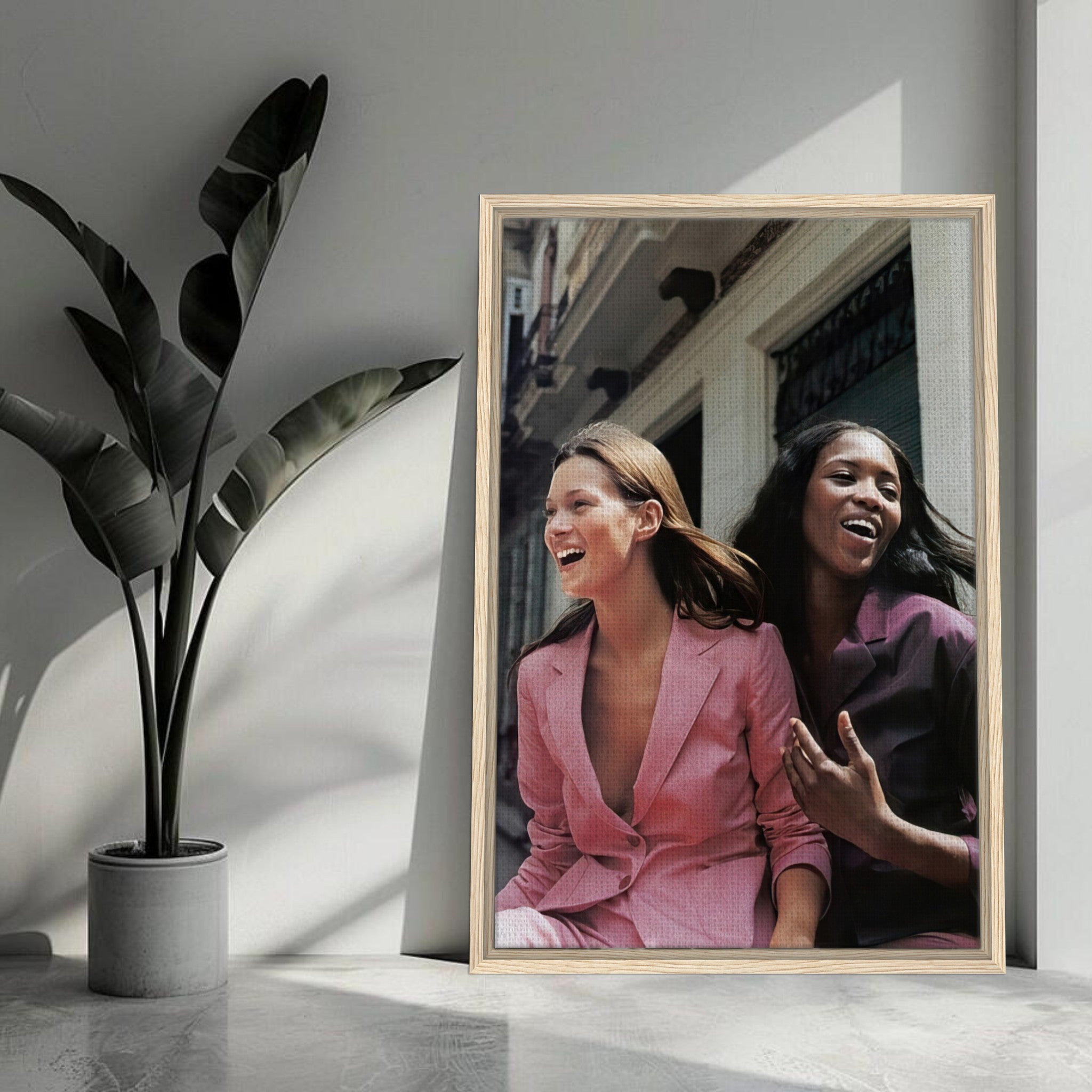 Framed canvas print of Naomi Campbell and Kate Moss, showcasing elegance and style in a vibrant, iconic fashion moment.