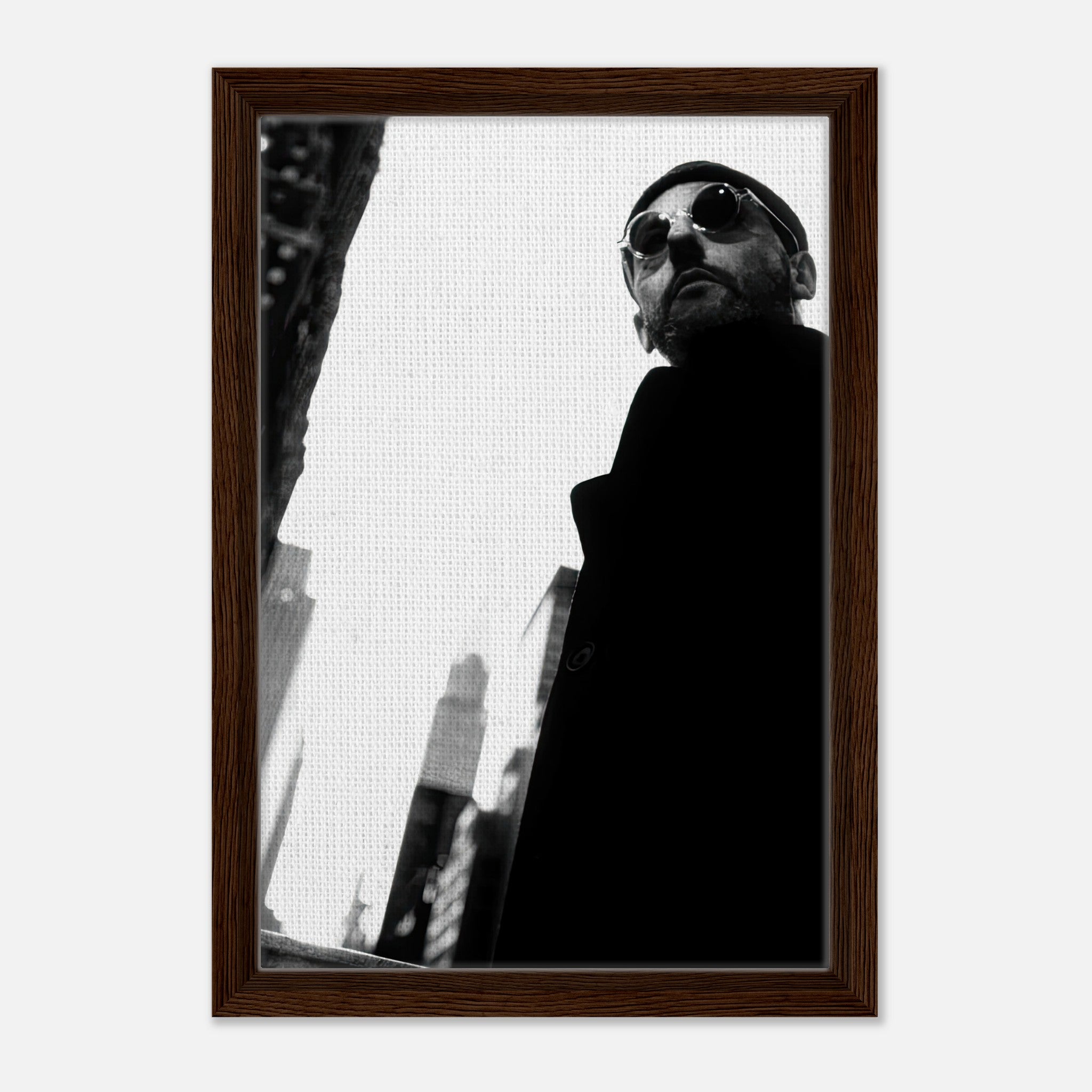 Jean Reno framed canvas print in black and white, showcasing urban sophistication and charm.