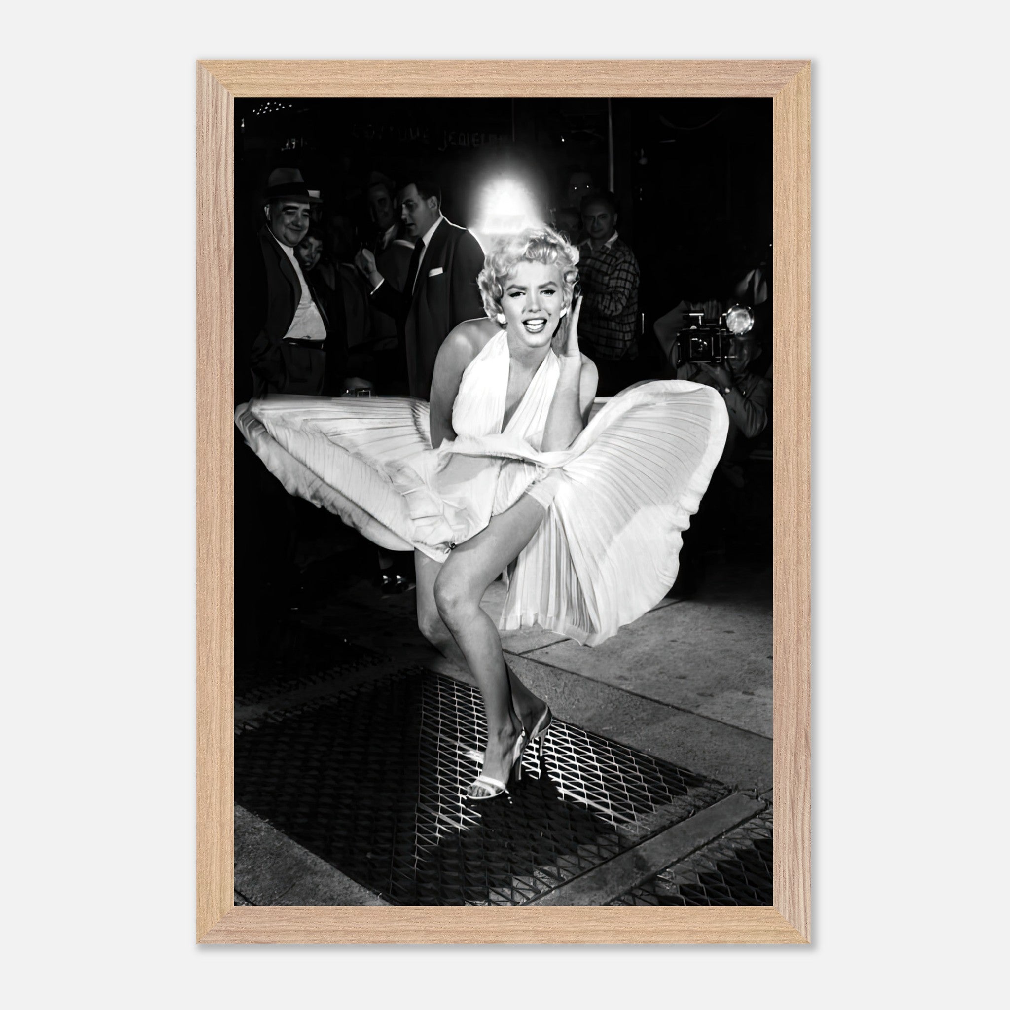 Marilyn Monroe in white dress playfully caught by wind, capturing Hollywood glamour in a fine art print.