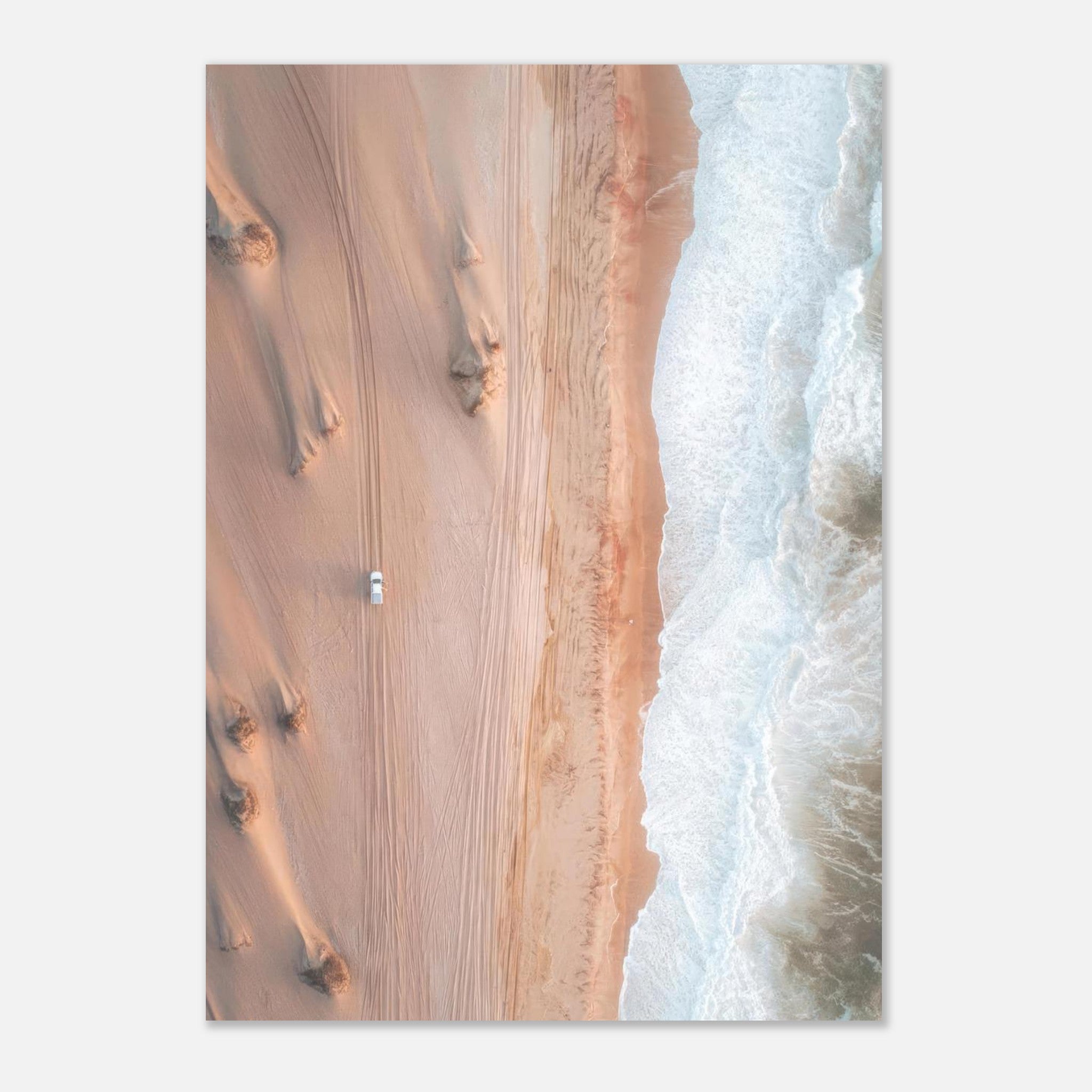 Aerial view of golden desert dunes meeting ocean waves in a stunning drone photography poster.
