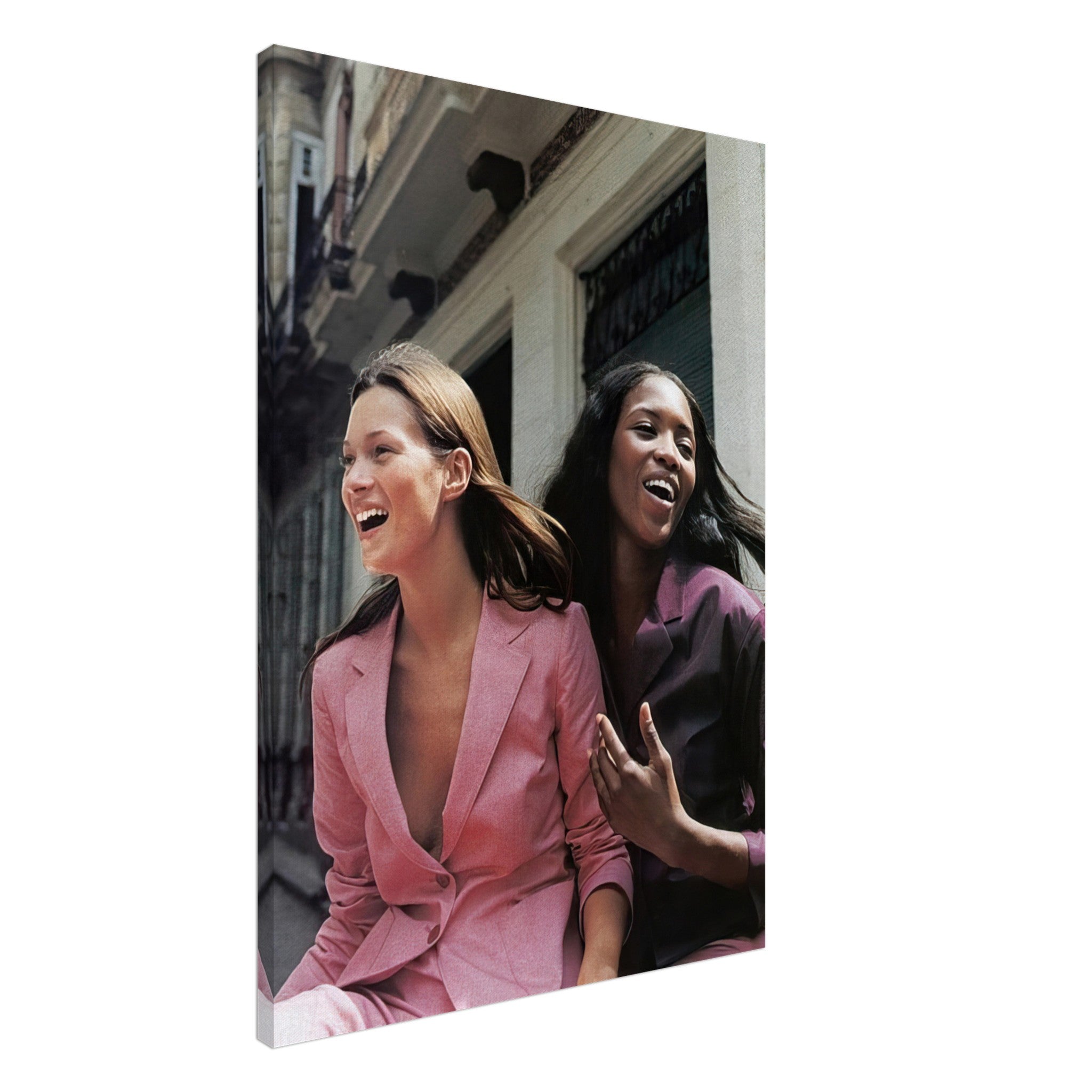 Naomi Campbell and Kate Moss laughing in stylish pink suits, captured in a fashion canvas print.