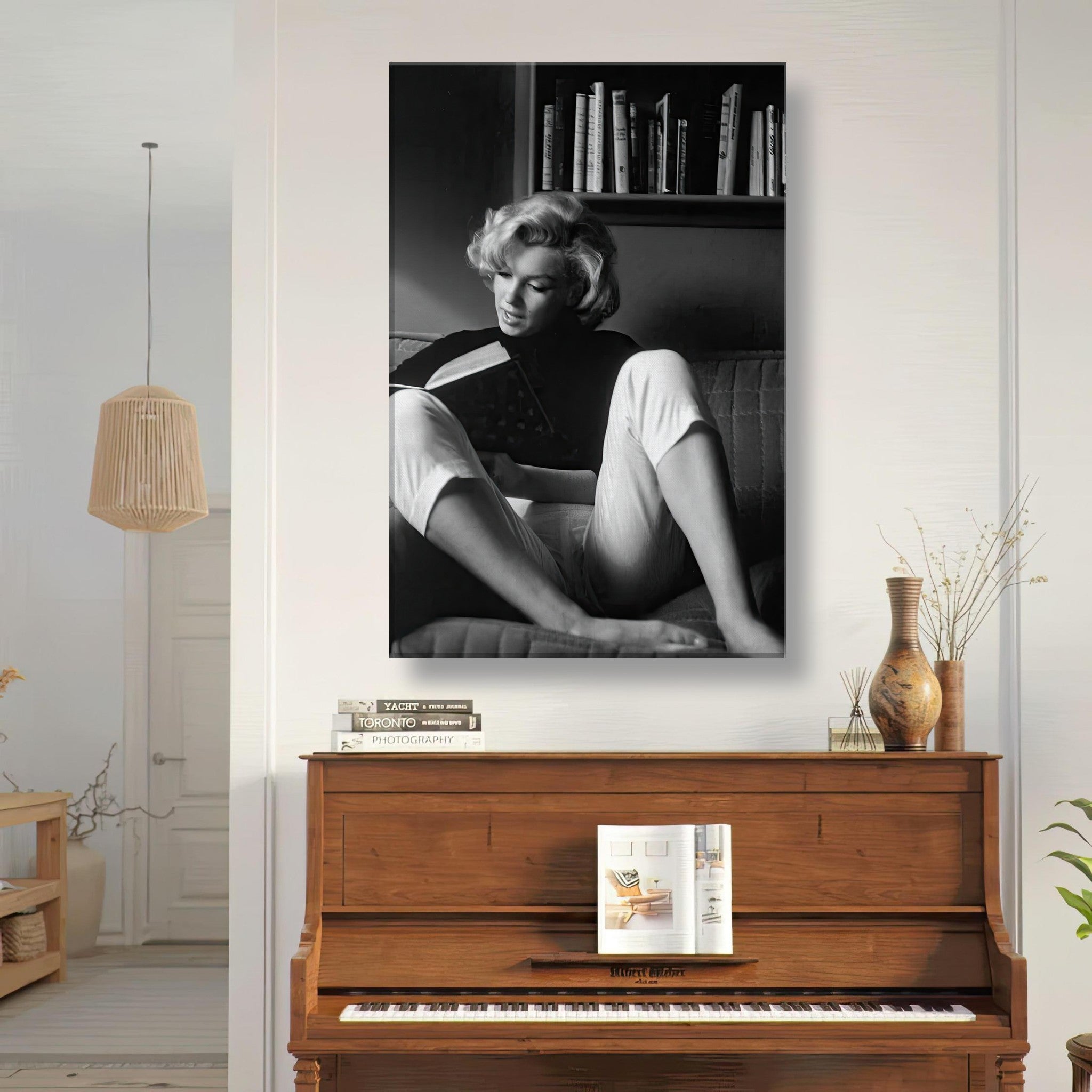 Marilyn Monroe reading at home in black-and-white canvas art, showcasing timeless elegance and Hollywood glamour.