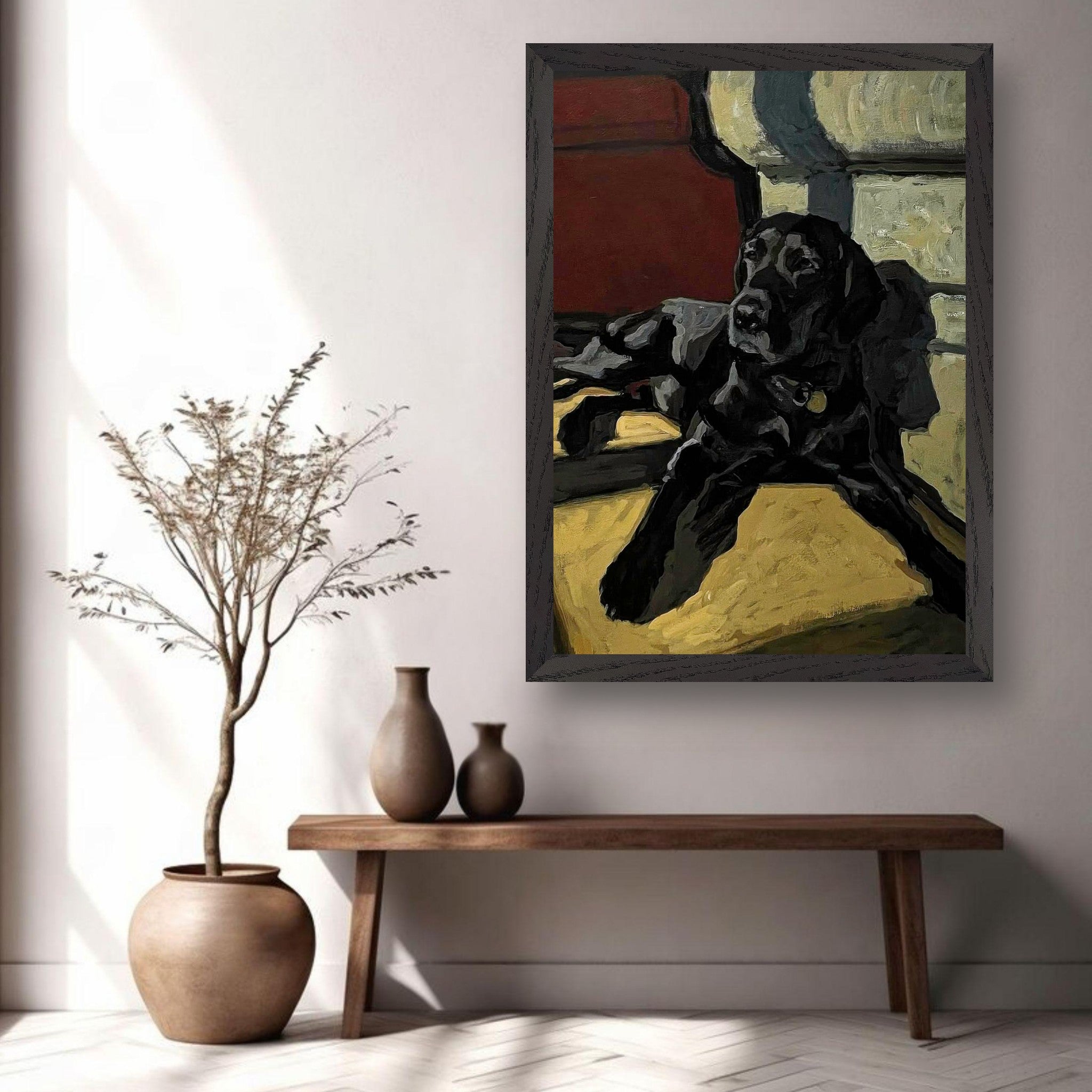 Black Labrador dog painting in a vintage frame, displayed in a cozy home setting with warm light.