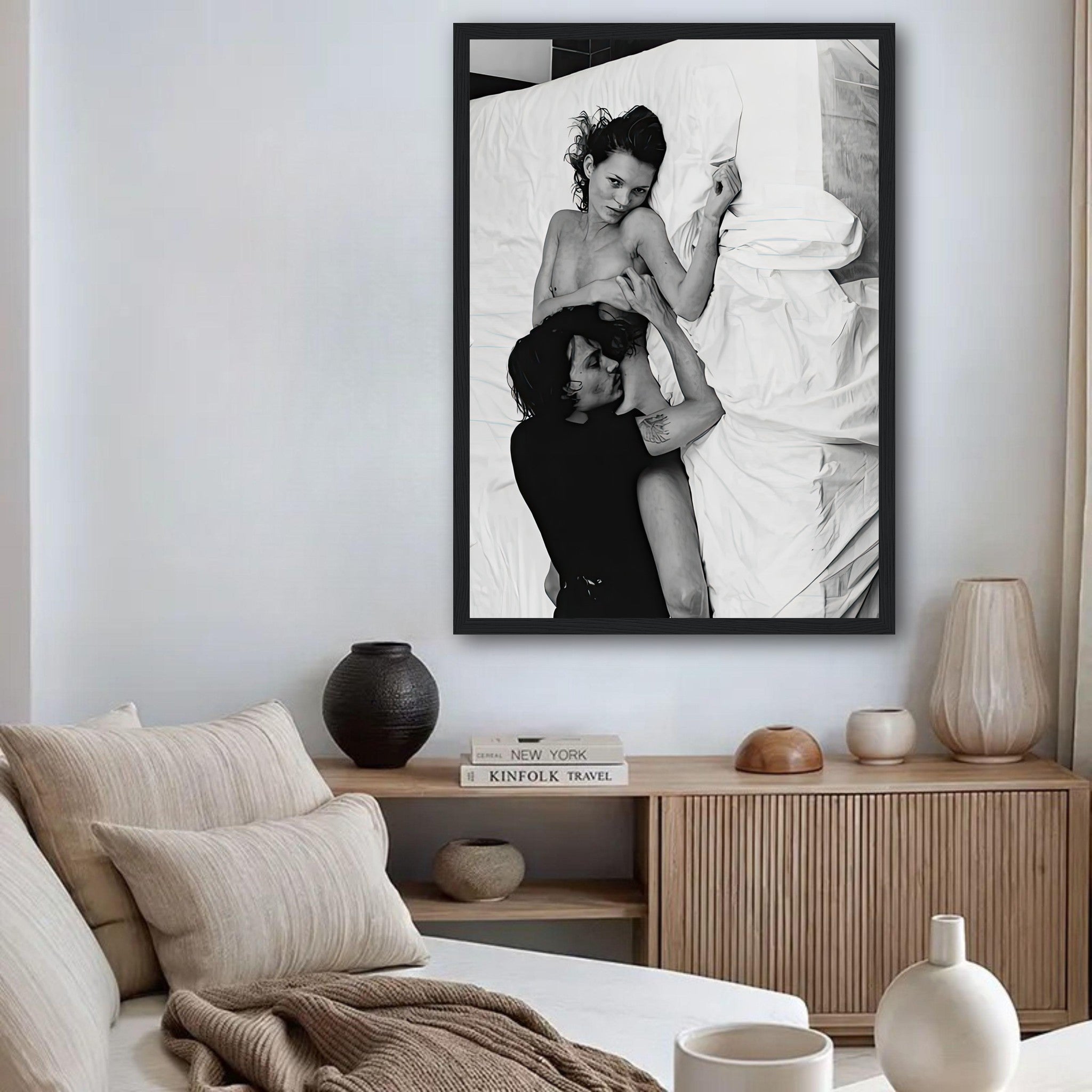 Framed print of Kate Moss and Johnny Depp, black-and-white art, 1994, displayed in a modern living room.