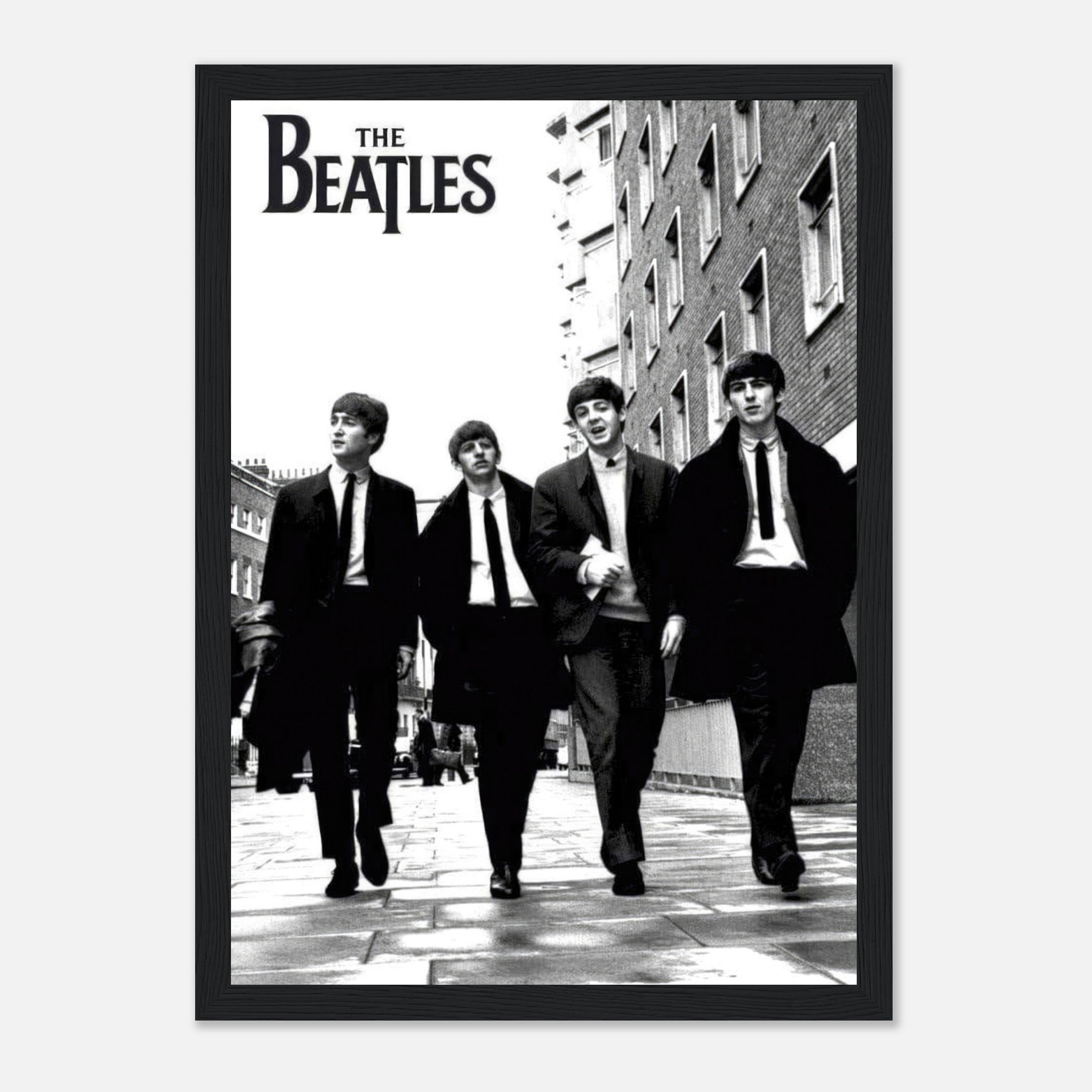 Framed print of The Beatles walking in black and white, featuring iconic band members in stylish suits.