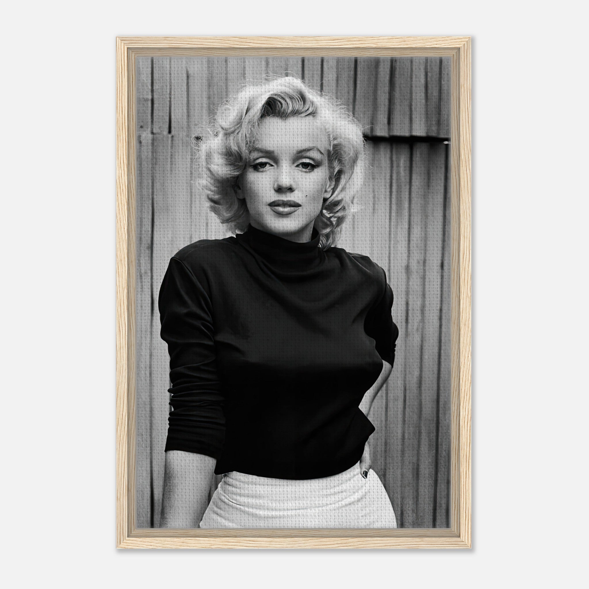Framed black-and-white portrait of Marilyn Monroe, showcasing her timeless elegance and iconic beauty.