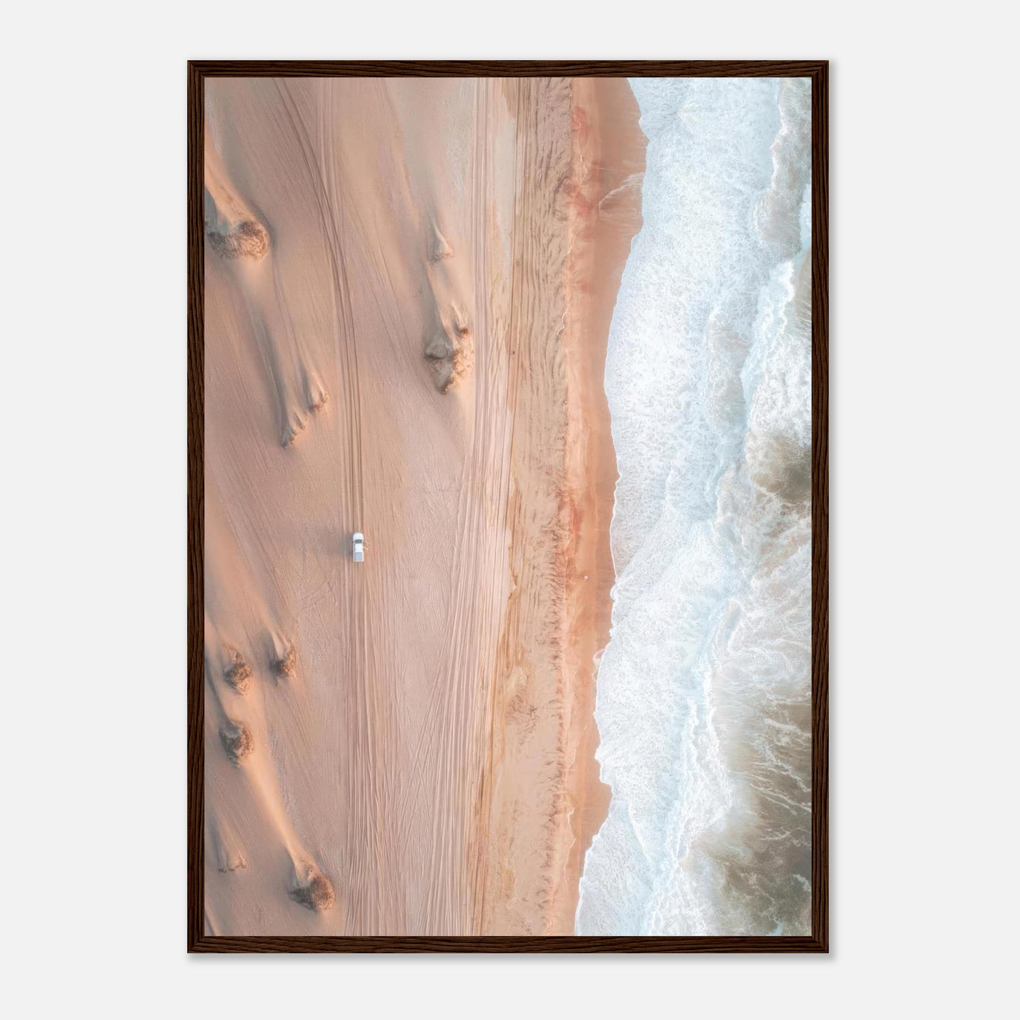 Aerial drone photography of desert meeting ocean, featuring rolling dunes and crashing waves, framed print decor.