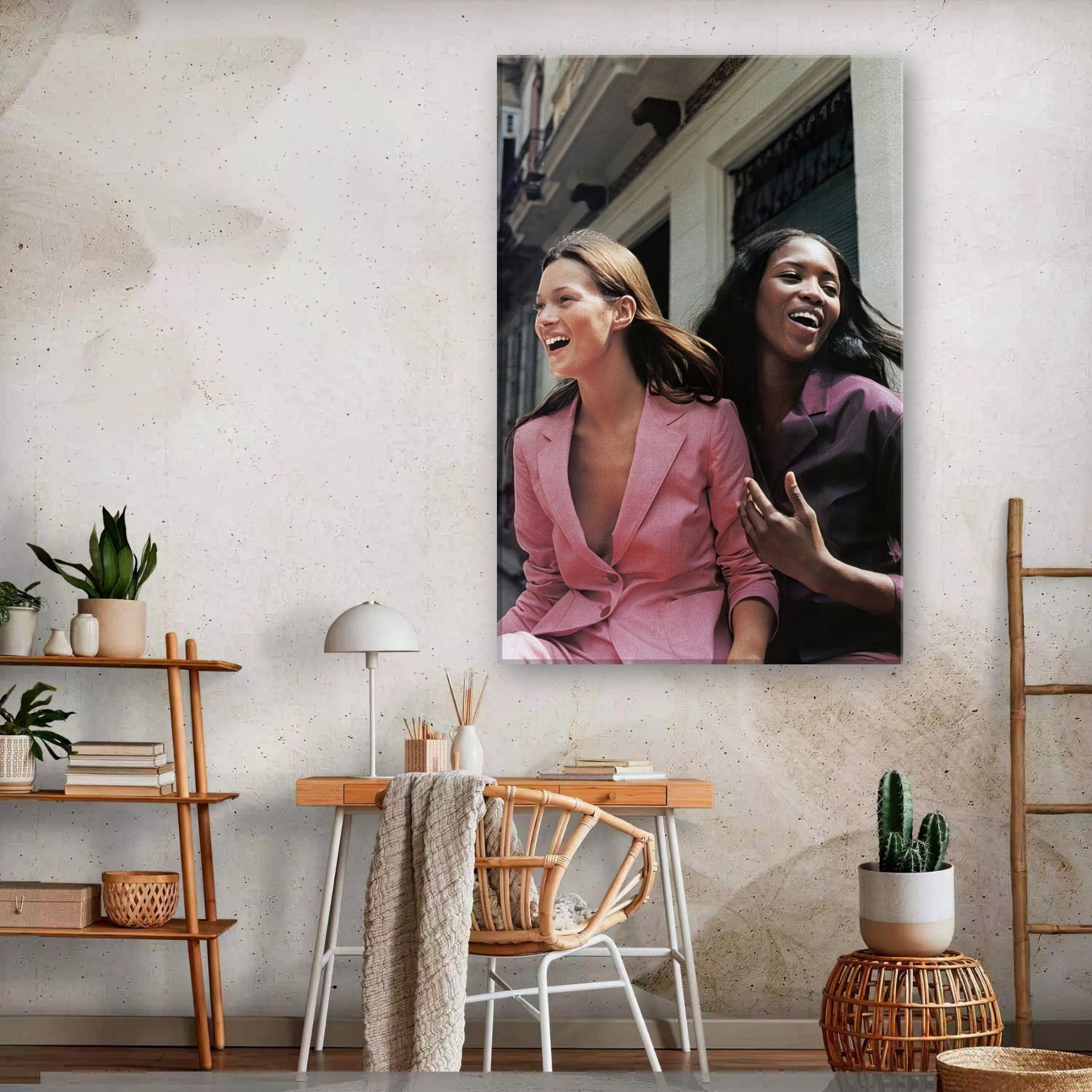 Naomi Campbell and Kate Moss laughing in stylish outfits on a canvas print, adding elegance to home decor.