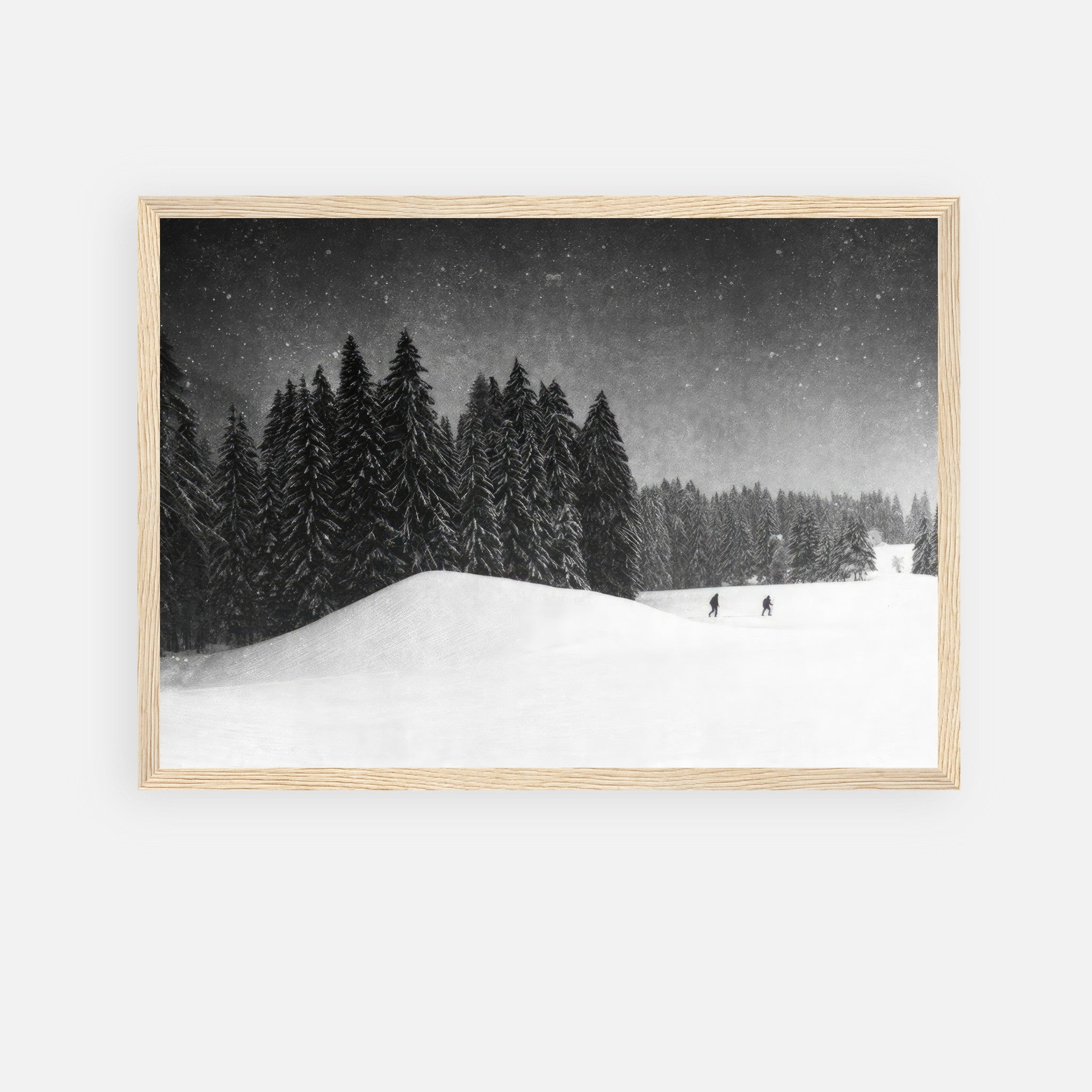 Framed print of a serene winter landscape with snow-covered trees and skiers, adding elegance to any space.