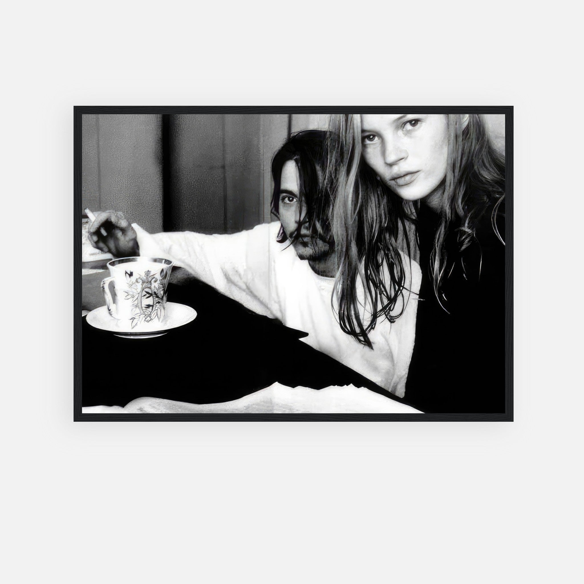 Framed print of Johnny Depp and Kate Moss in black-and-white, capturing 1990s rebellious romance and artistic intimacy.