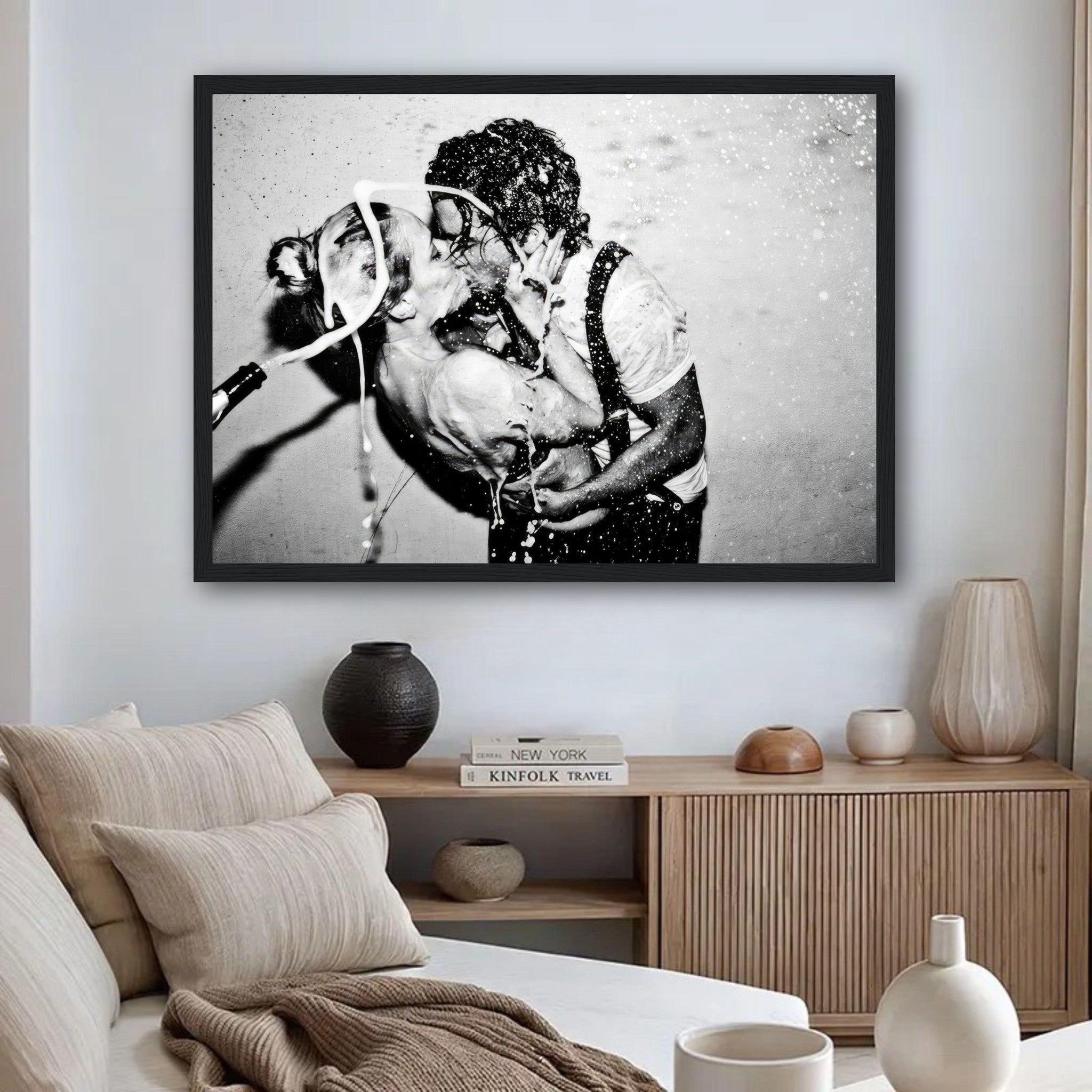 The Champagne Kiss framed print featuring Johnny Depp and Kate Moss in a passionate moment with champagne.