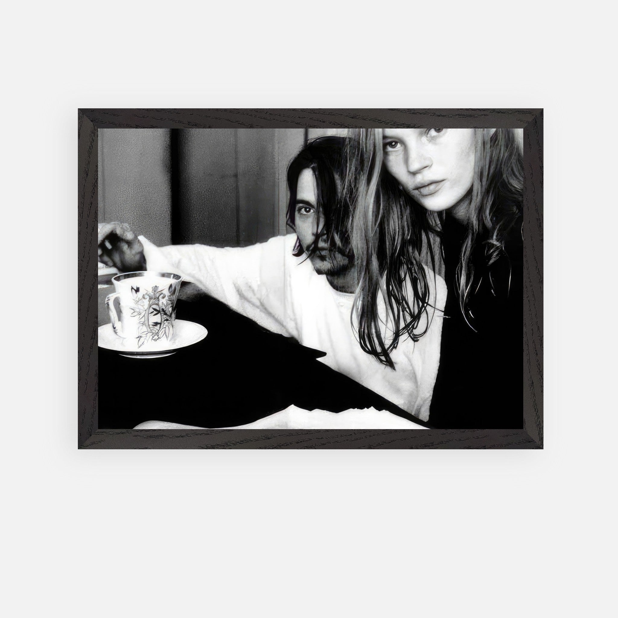 Vintage framed art of Johnny Depp and Kate Moss, capturing 90s rebellion and romance.