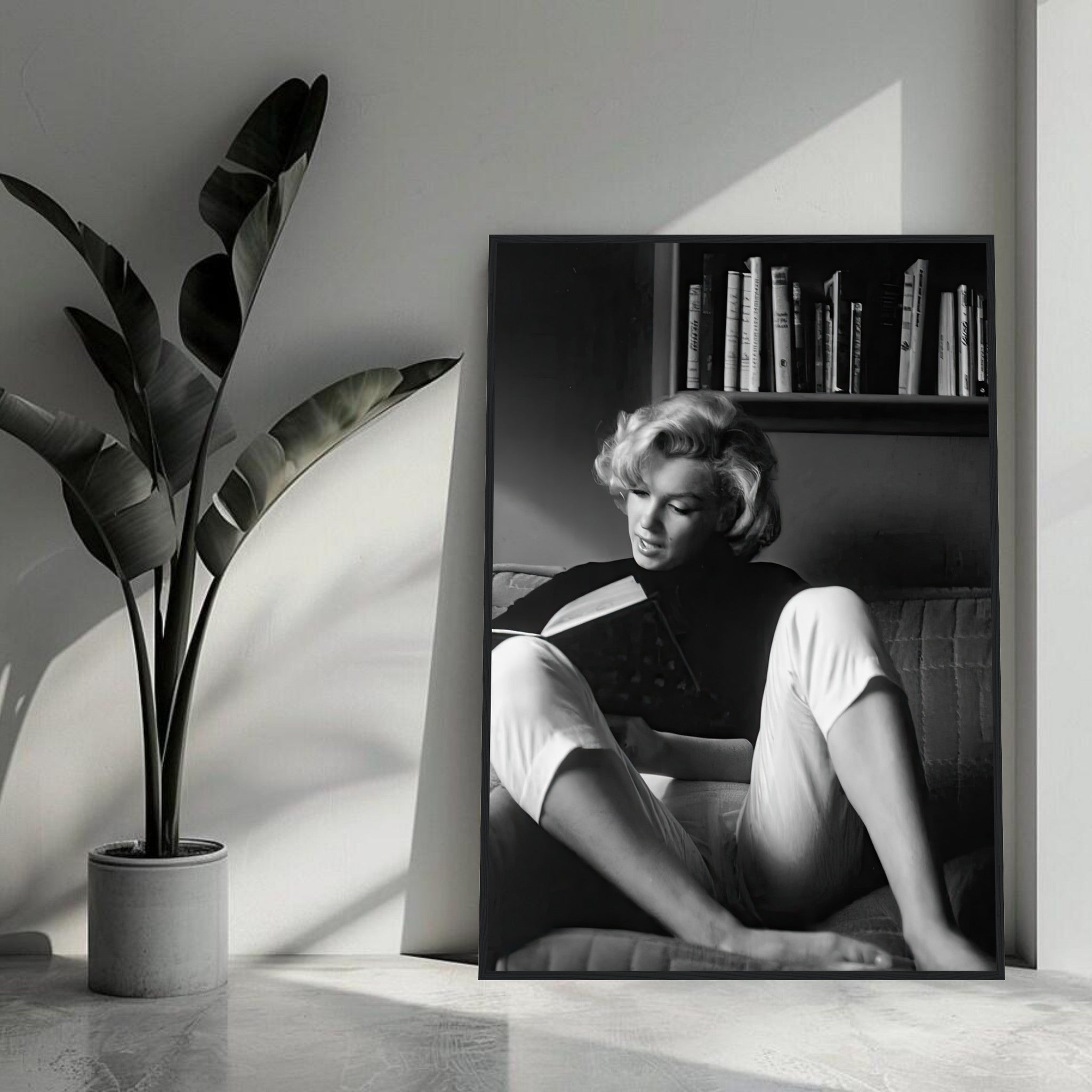 Marilyn Monroe reading at home in a framed print, capturing timeless Hollywood elegance and charm.
