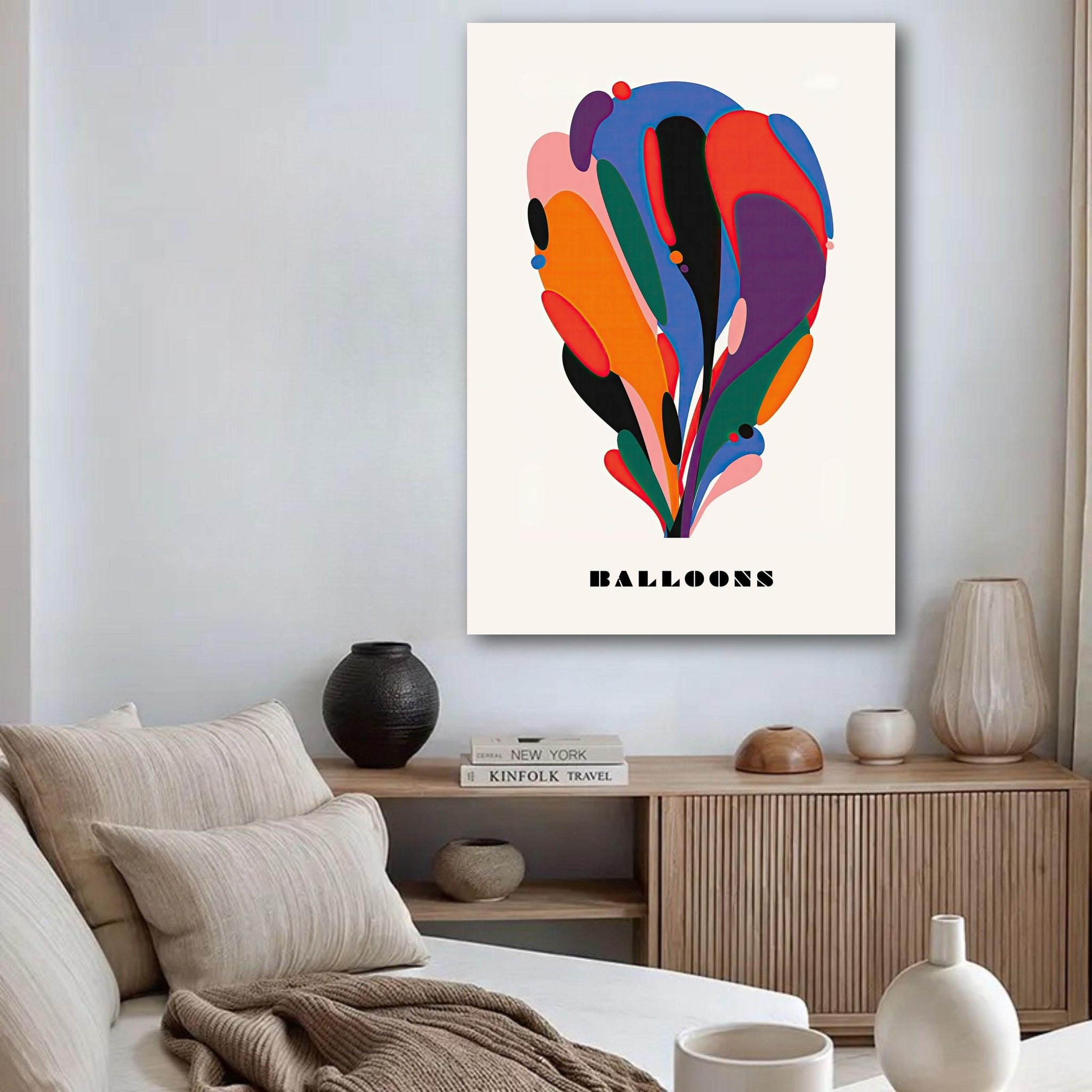 Colorful abstract balloon art poster on a wall in a stylish living room with modern decor.