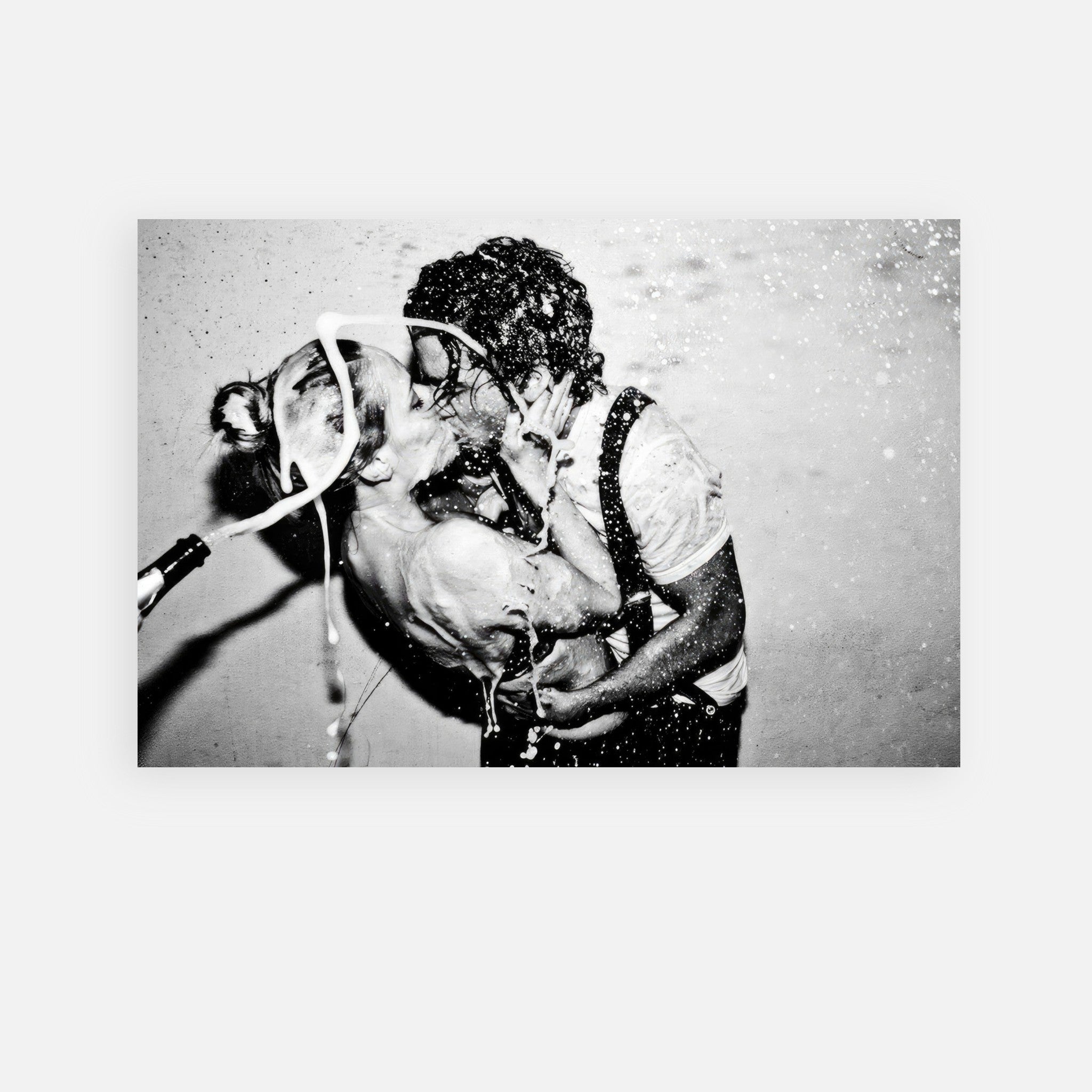 The Champagne Kiss metal print featuring Johnny Depp and Kate Moss embracing in a champagne-spraying moment.